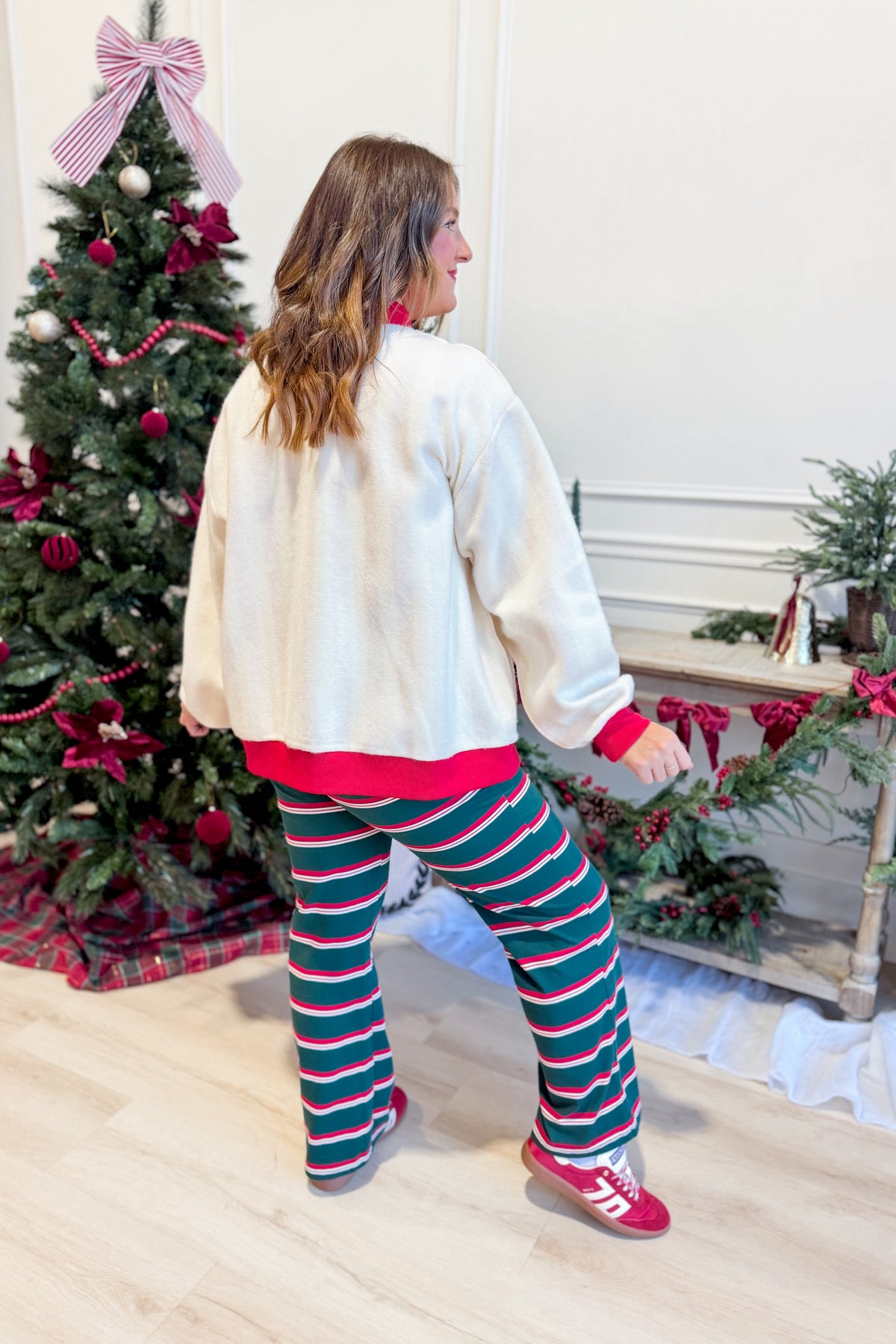Red and white striped reversible sweatshirt from PEACH LOVE, featuring a Merry graphic design on 137 Graphic Sweatshirts.