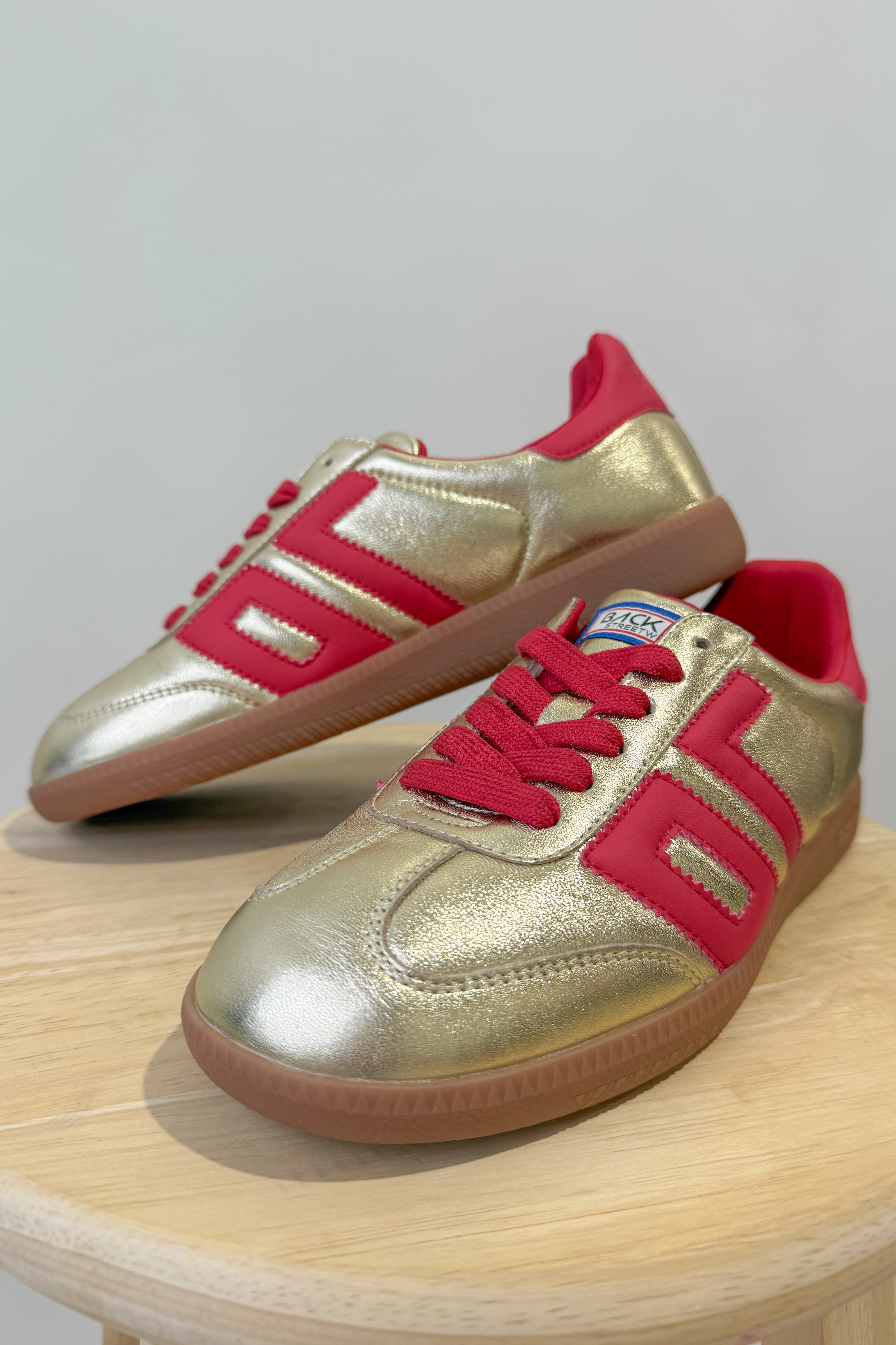 BACK 70 Cloud Sneakers in gold and red with a sleek 205 sneaker design, featuring a modern, stylish look.