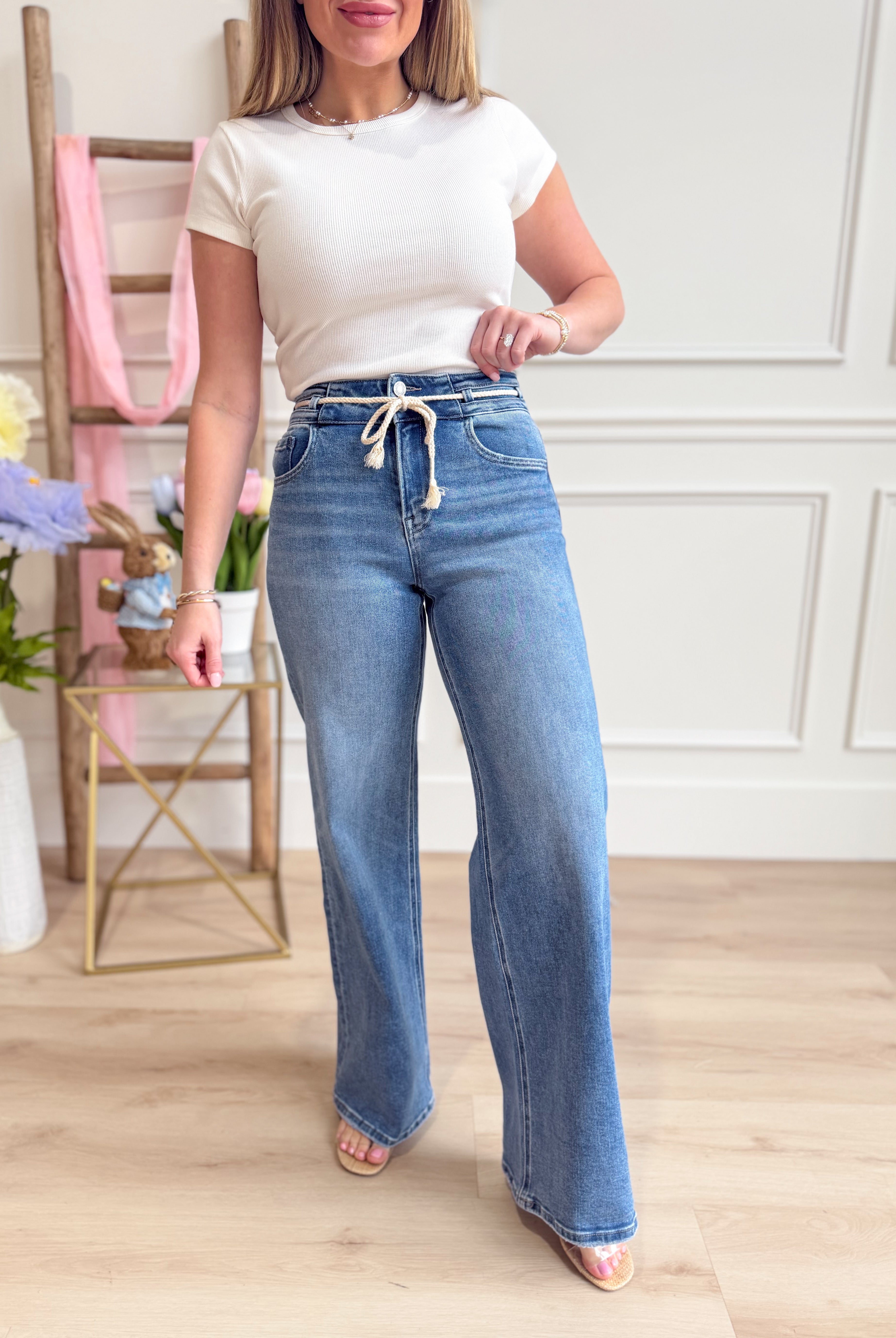 Vervet Olivia high-rise double button drawstring core jeans with back pockets and distressed details, in a classic denim wash.