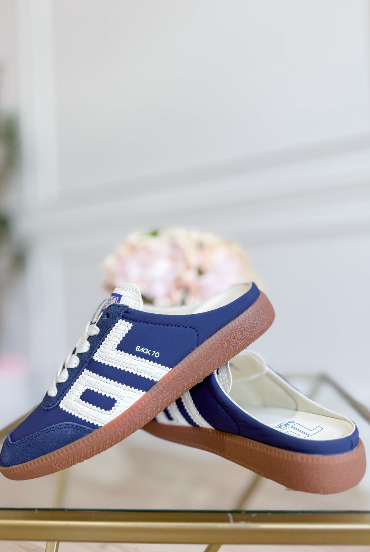 Navy backless sneaker from BACK 70's 205 Sneakers collection, featuring a sleek, minimalist design with a low profile and casual style.