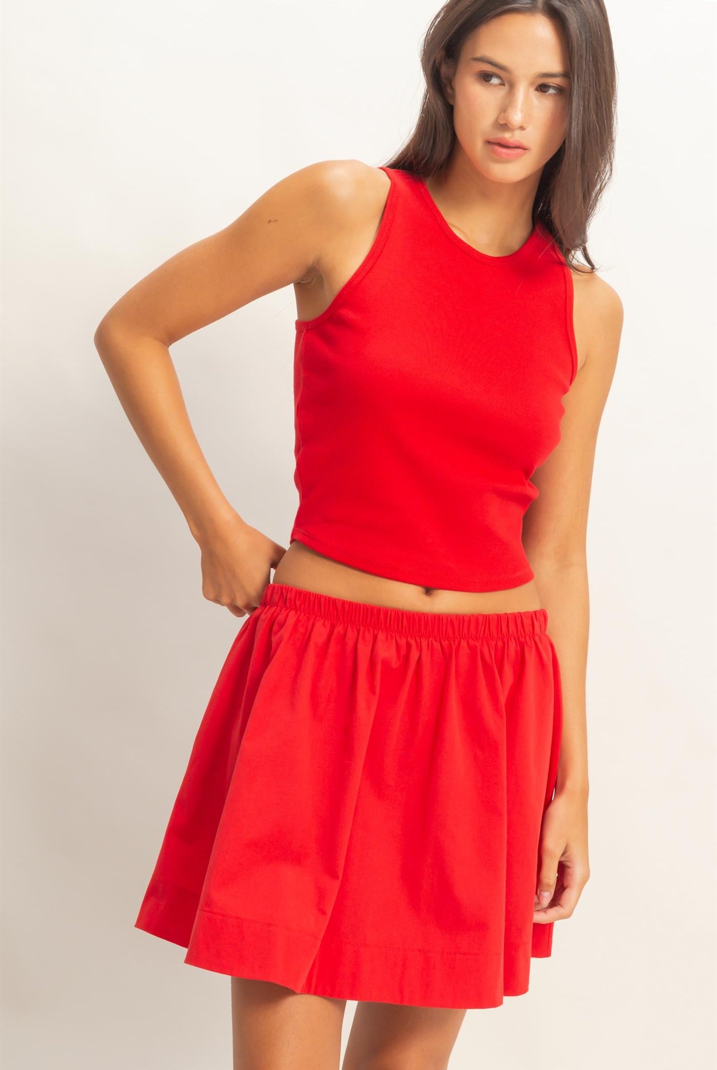 HYFVE Carter red sleeveless ribbed skirt set featuring a fitted crop top and matching high-waisted skirt.