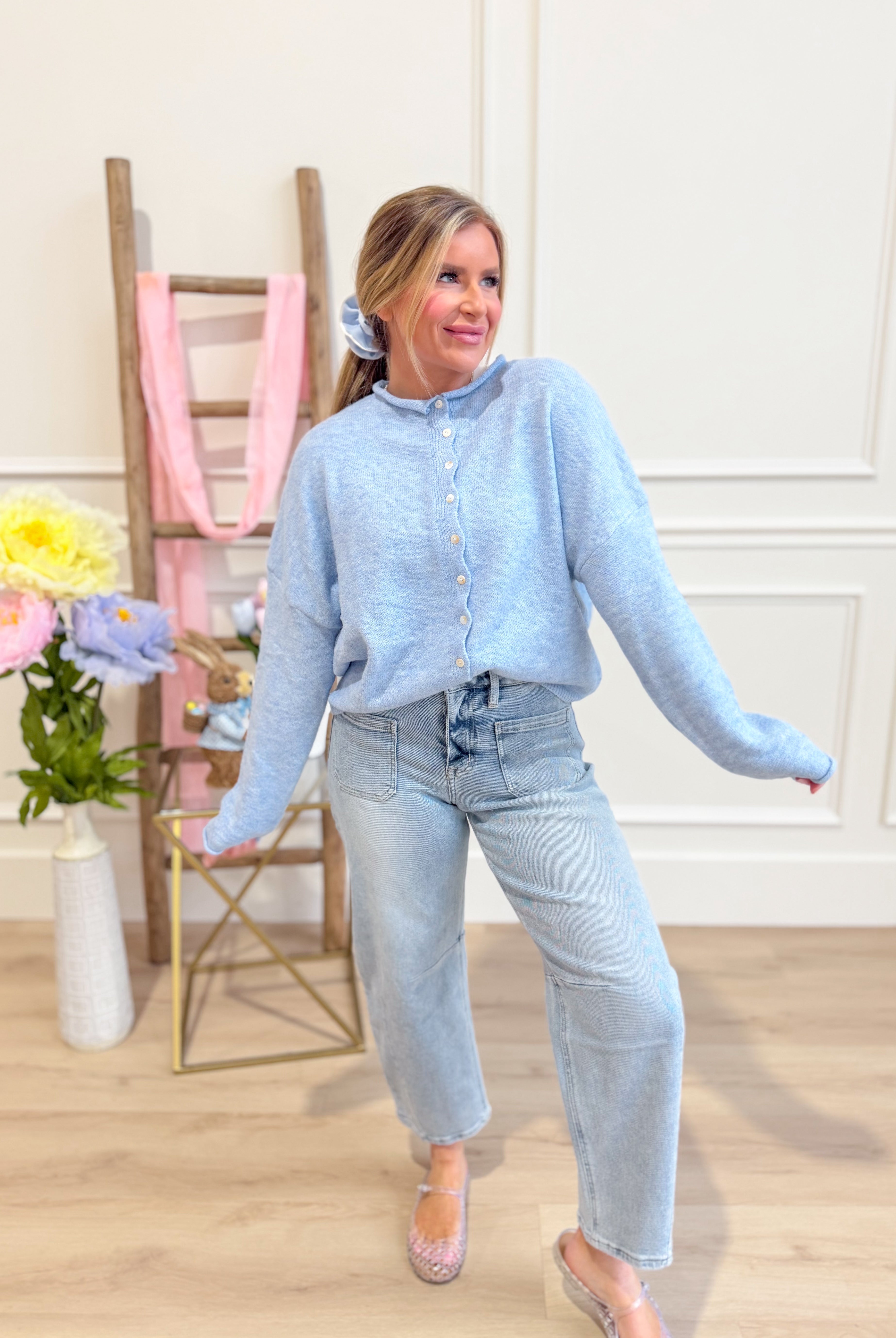 Sky blue Luna button-down cardigan from THINGS BETWEEN, featuring a classic sweater design with a front button closure.