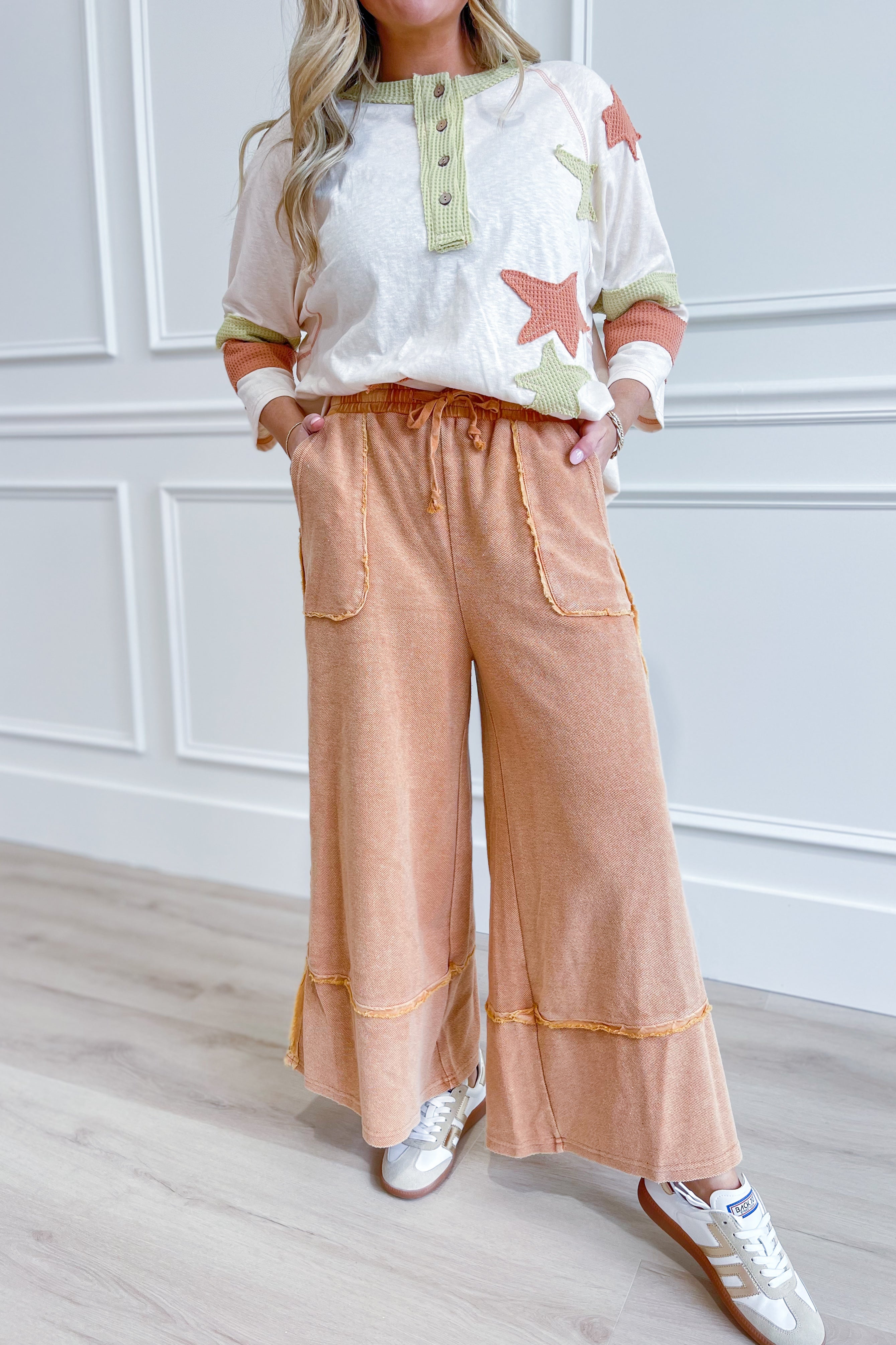 EASEL Caris mineral washed upside down terry knit wide-leg palazzo pants in neutral tones, styled with relaxed fit and high waist.