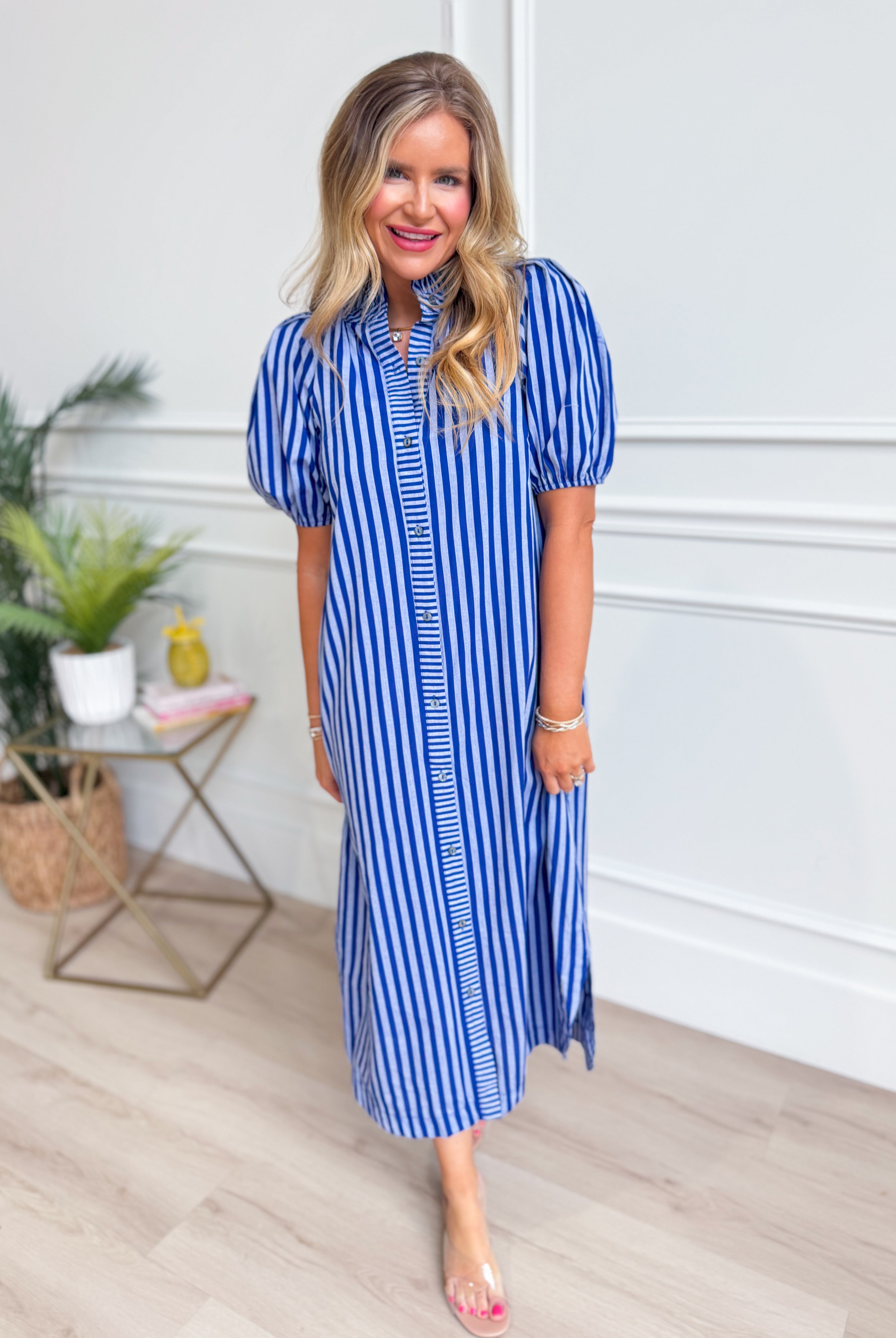 ENTRO Susie striped midi dress featuring a casual, flowing design with a fitted bodice and knee-length hem in a vibrant stripe pattern.