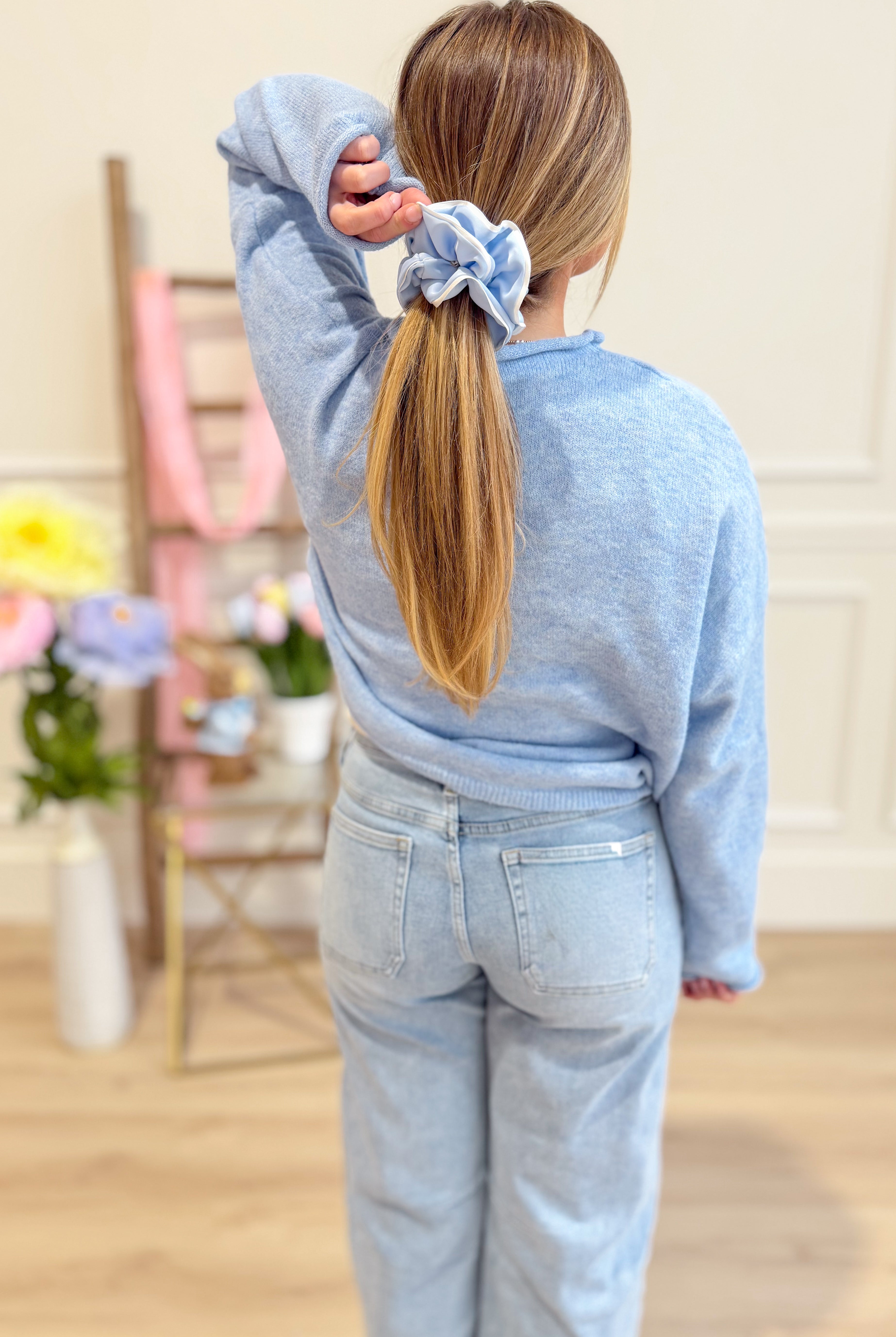 Sky blue Luna button-down cardigan from THINGS BETWEEN, a stylish spring sweater with a classic design.