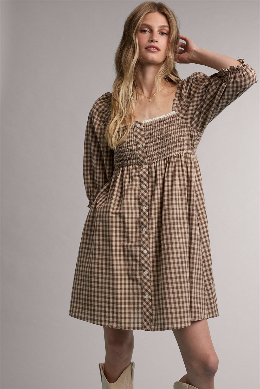 WISHLIST Jason plaid babydoll dress with long sleeves and a fitted waist, featuring a stylish plaid pattern and flowy skirt.