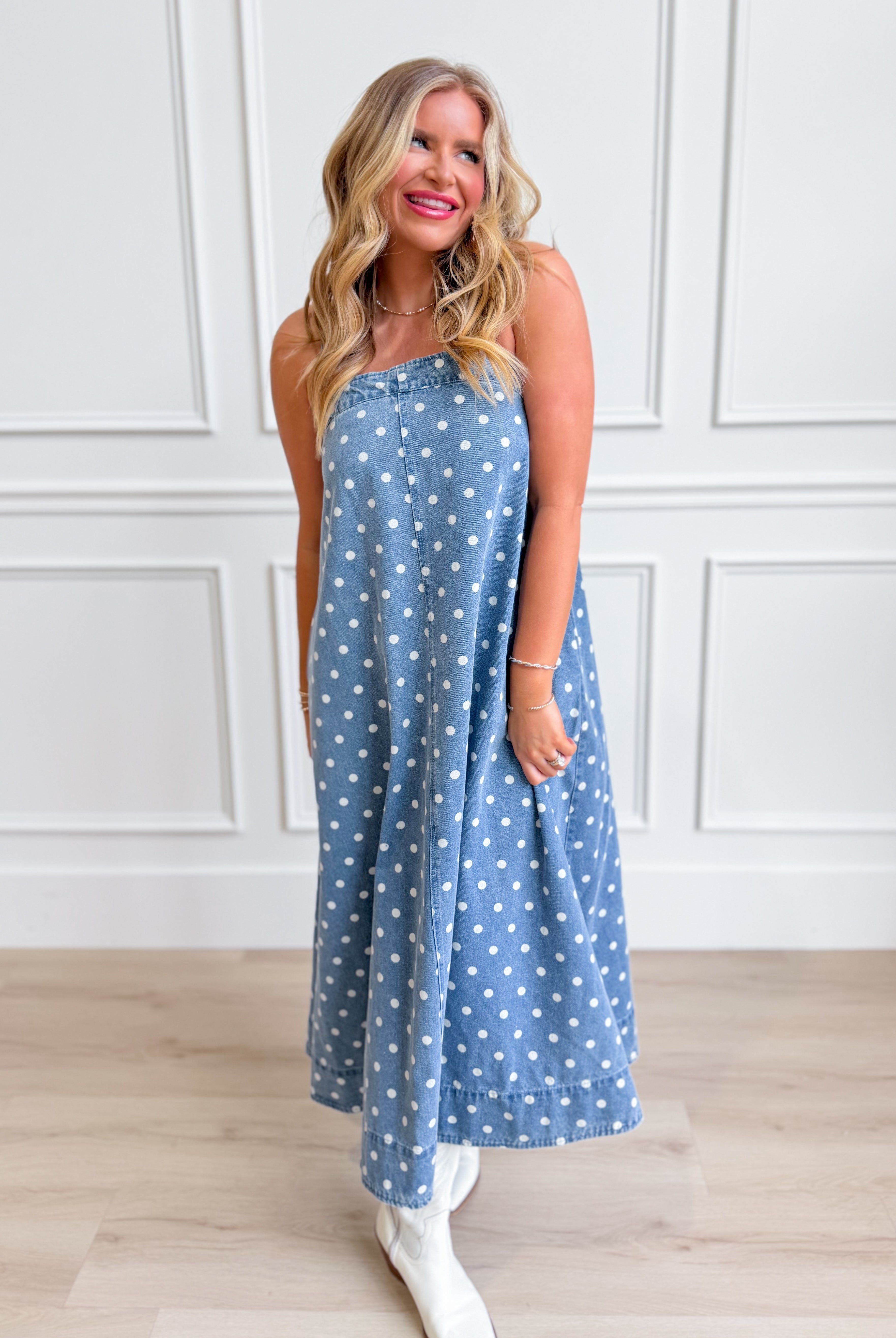 Aureum Mia polka dot denim dress with a fitted bodice and flared skirt, featuring classic polka dot pattern and stylish design.