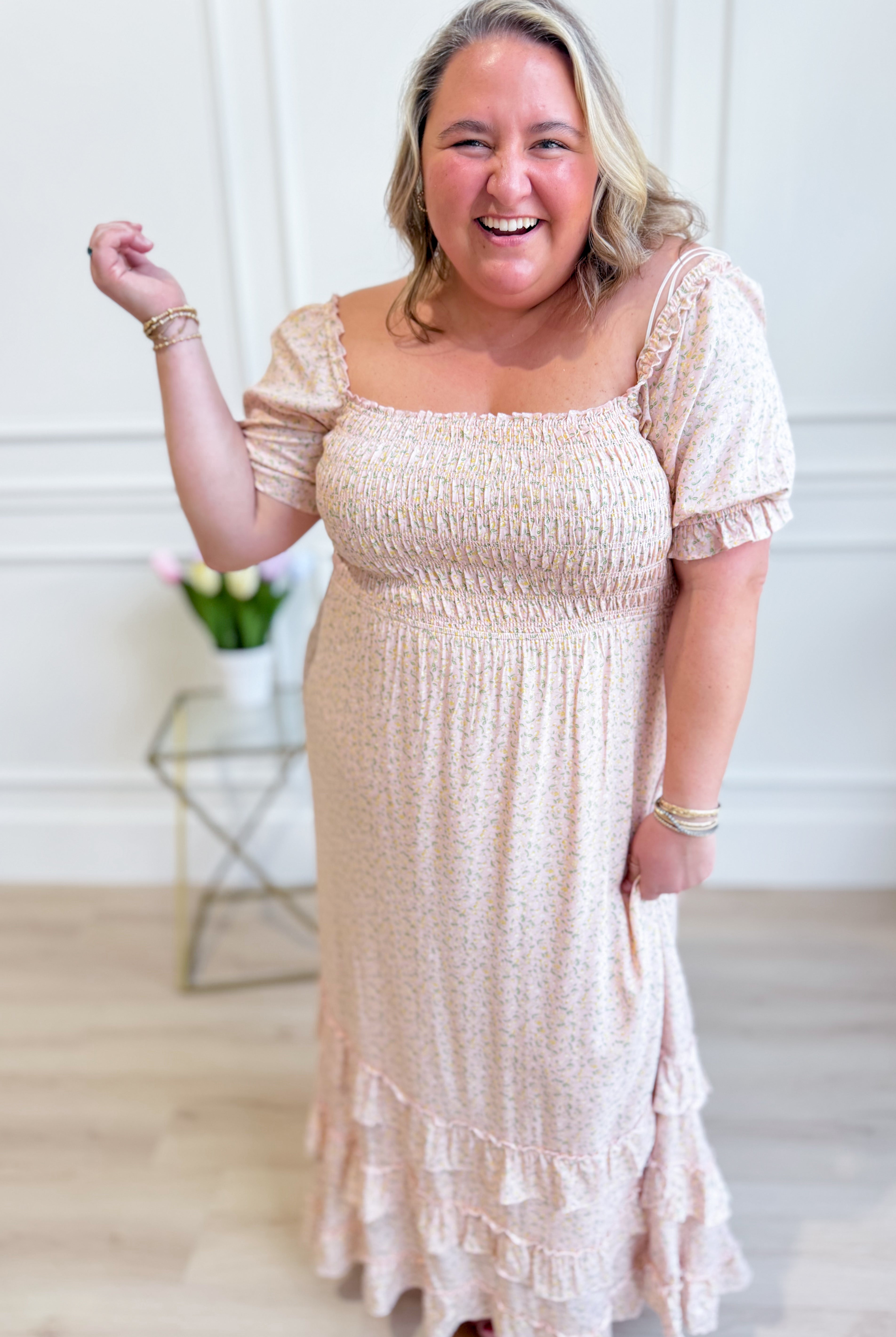 IN LOOM Luna smocked floral maxi dress with a flowy silhouette, featuring a smocked bodice and vibrant floral pattern.