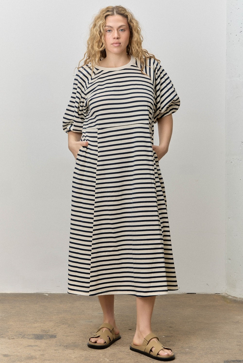 Rebecca navy striped midi dress by BAEVELY, featuring a stylish, flowy design with a fitted waist and classic stripe pattern.