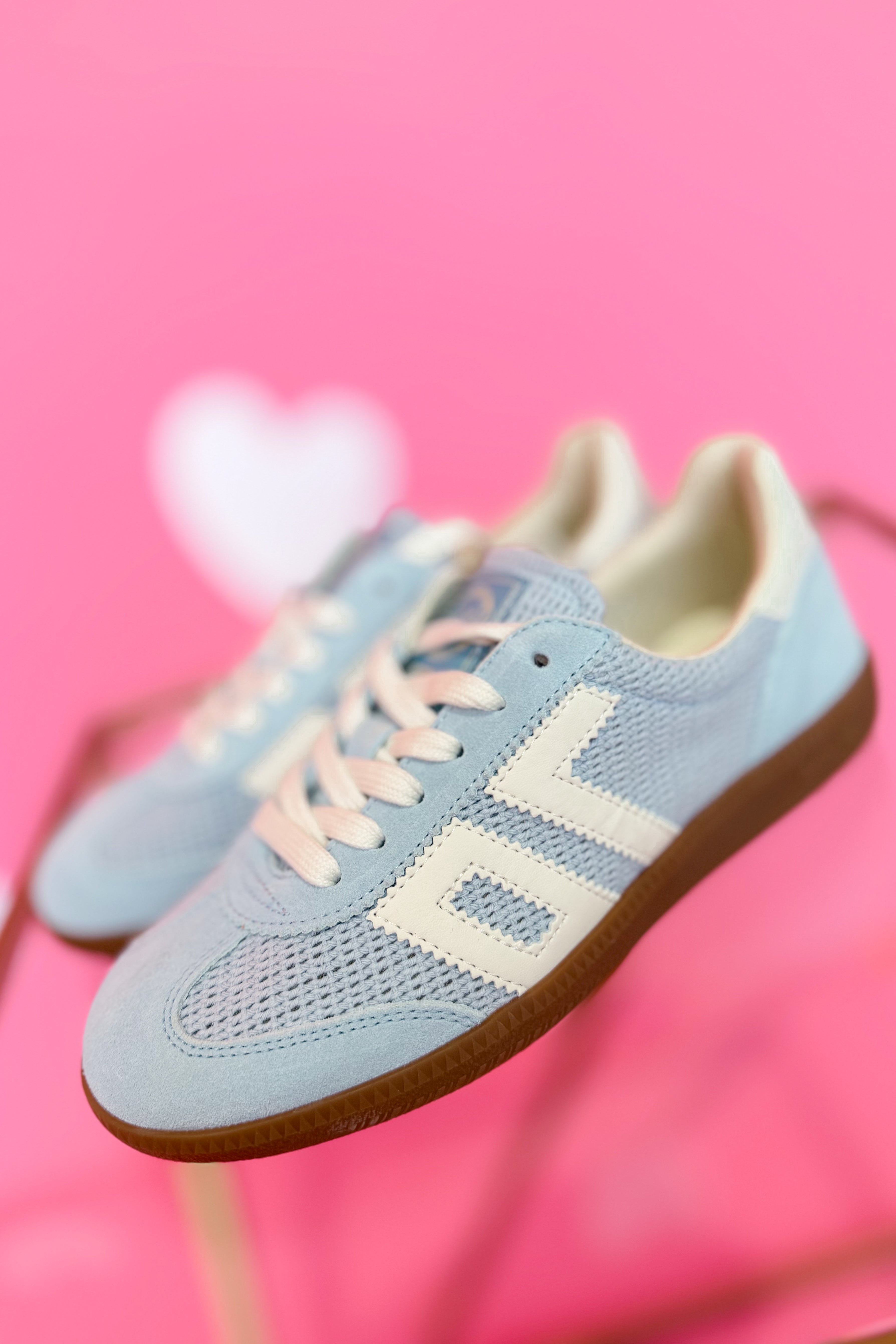 Back 70 Ghost Sneakers in Sky Blue, 205 sneaker style, featuring sleek design and vibrant color, worn on a casual setup.