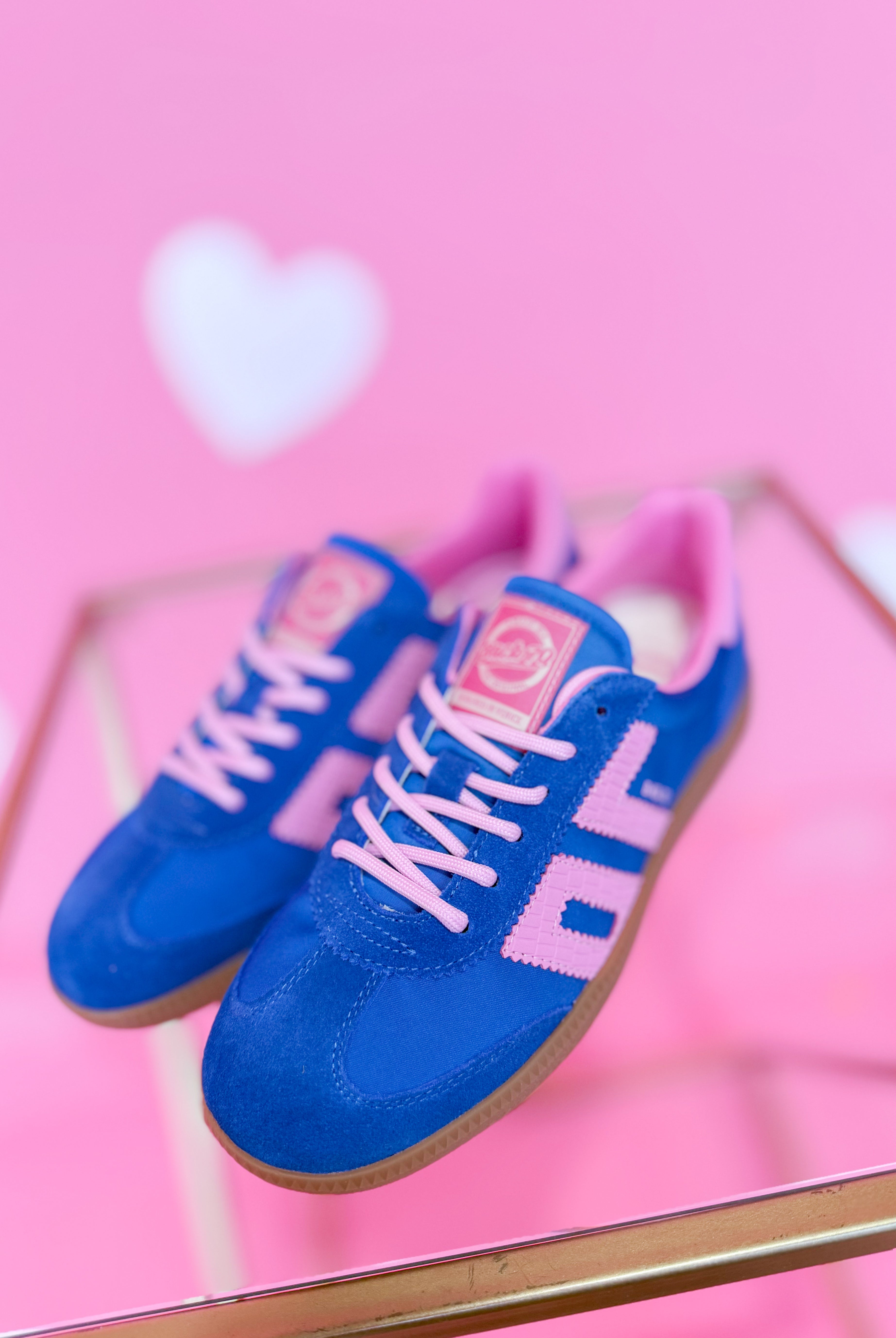 BACK70 Ghost Sneakers in blue and pink with a sleek 205 sneaker design, featuring modern athletic style and vibrant color accents.