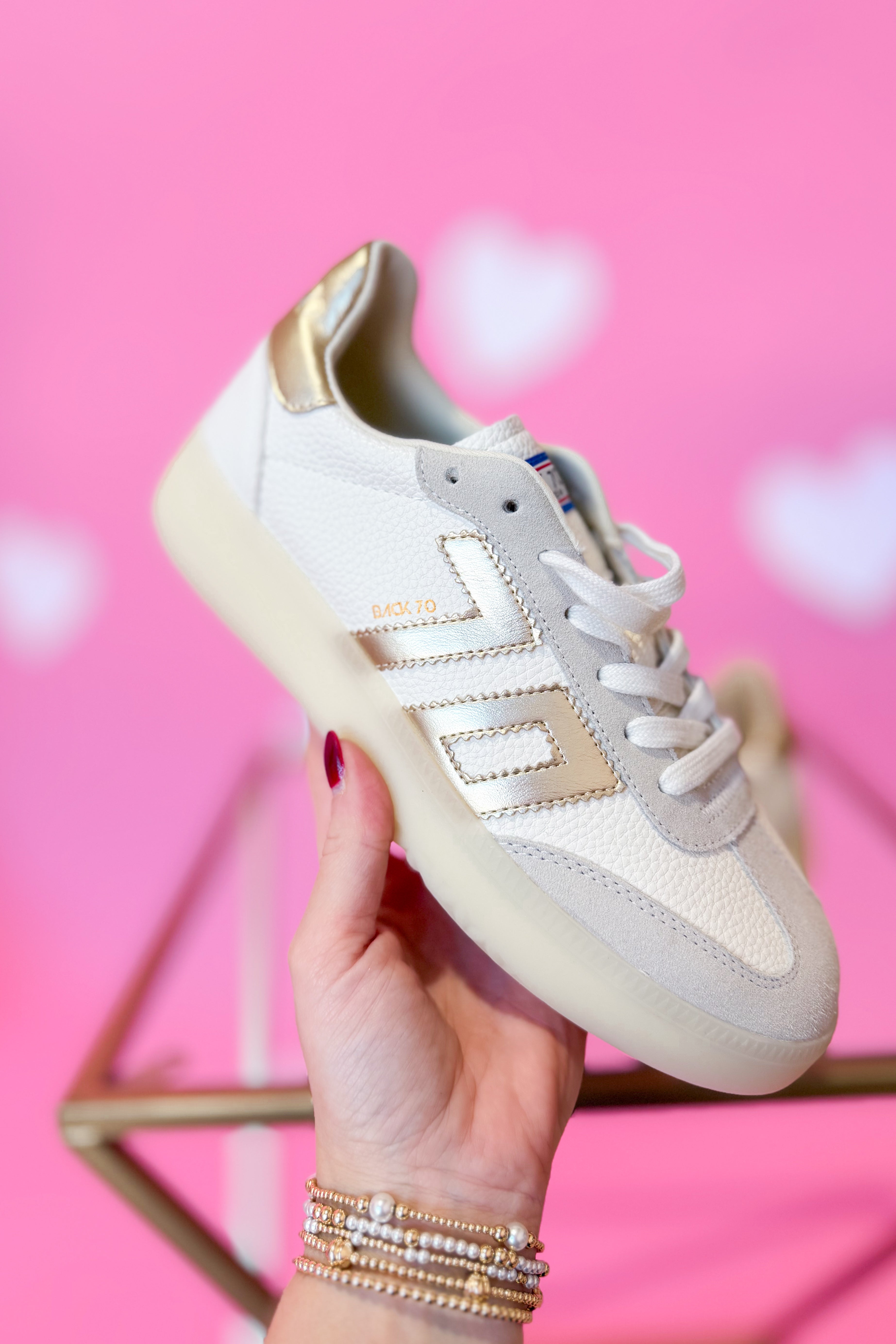 BACK 70 Boston 2502 gold sneaker, 205 sneaker style with shiny metallic finish, featuring white sole and stylish design.