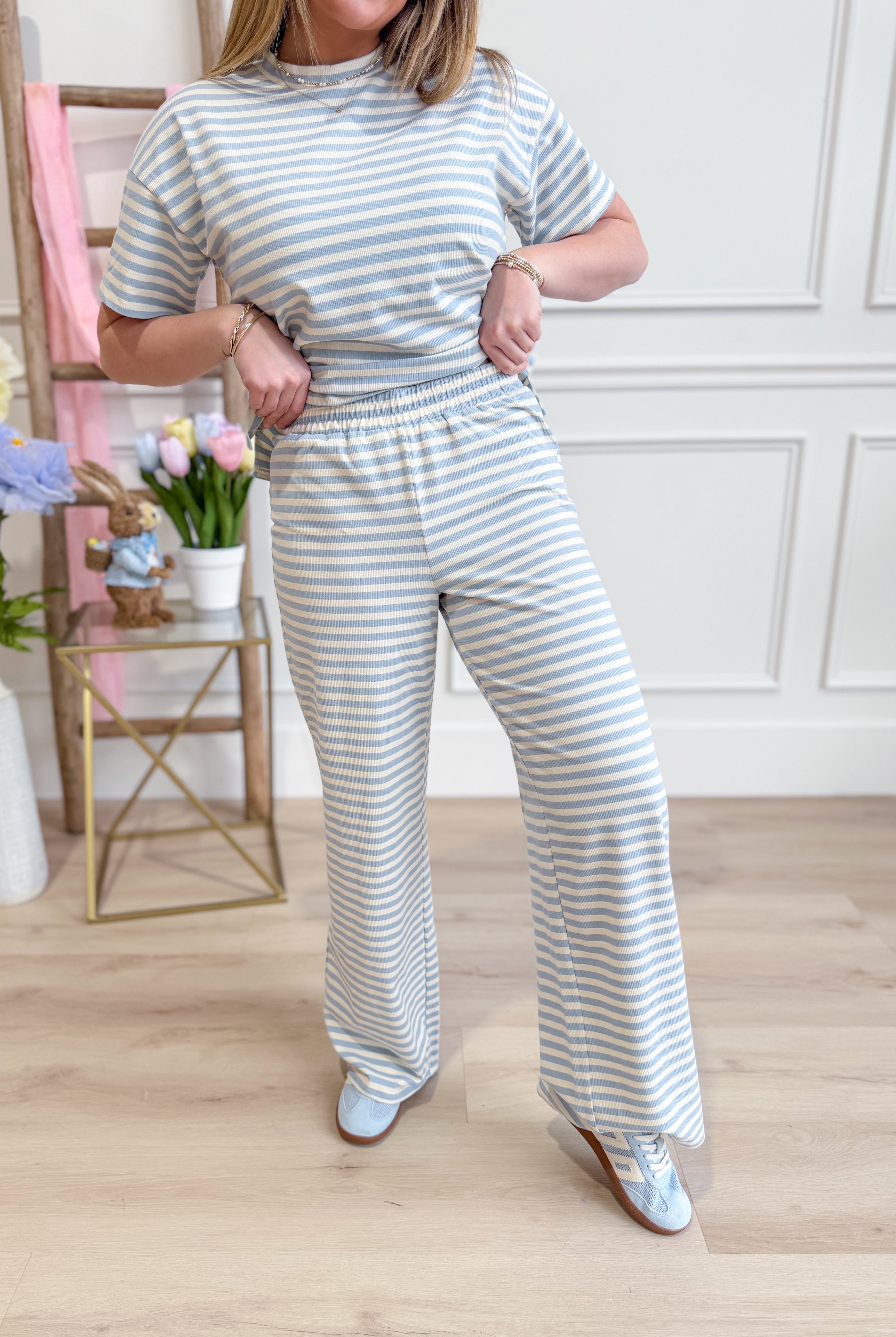Light blue mini striped casual pants by THINGS BETWEEN, featuring a relaxed fit and subtle stripe pattern.