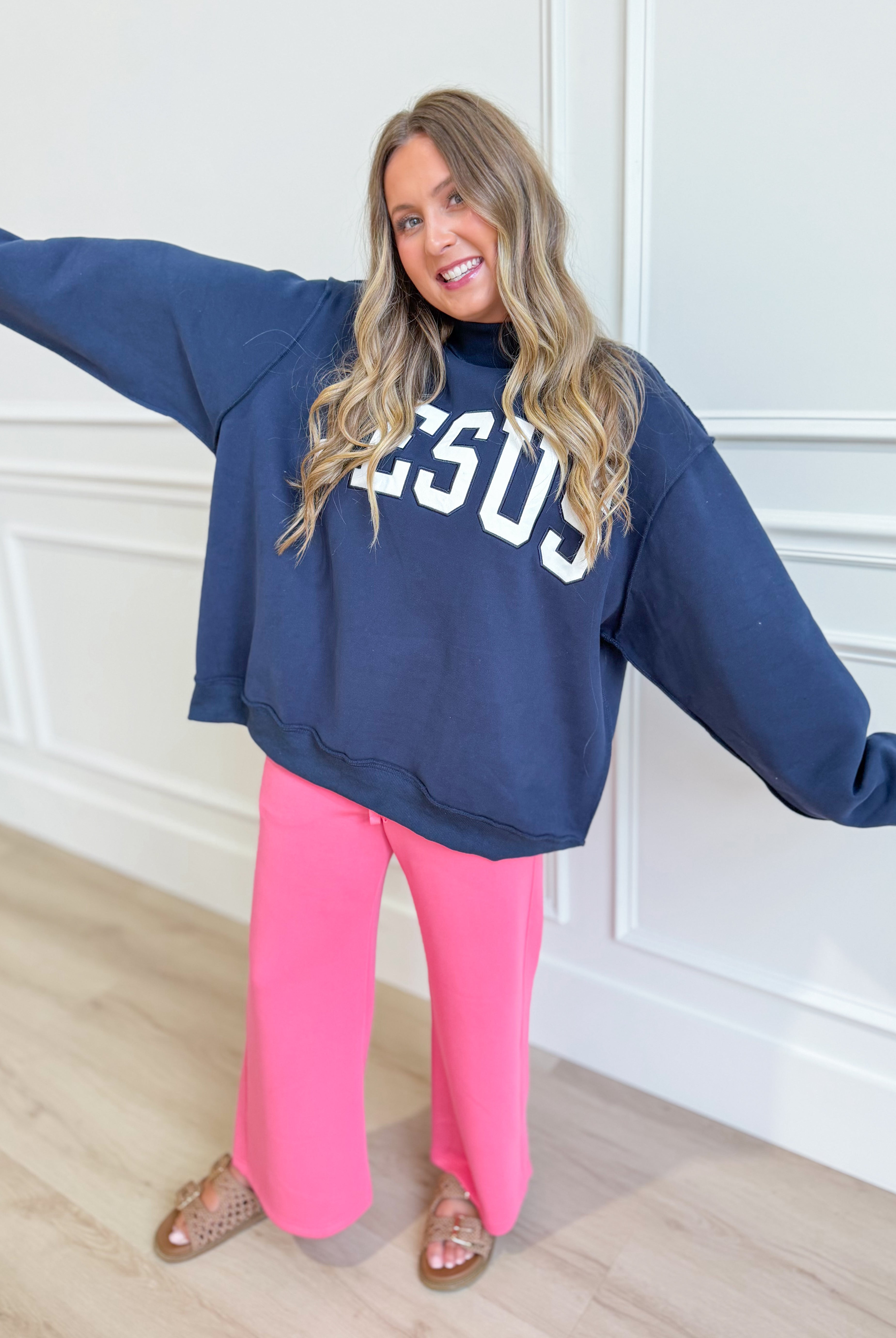 Jesus Navy mock embroidered sweatshirt from BUCKET LIST 137 Graphic Sweatshirts with a detailed Jesus graphic on the front.