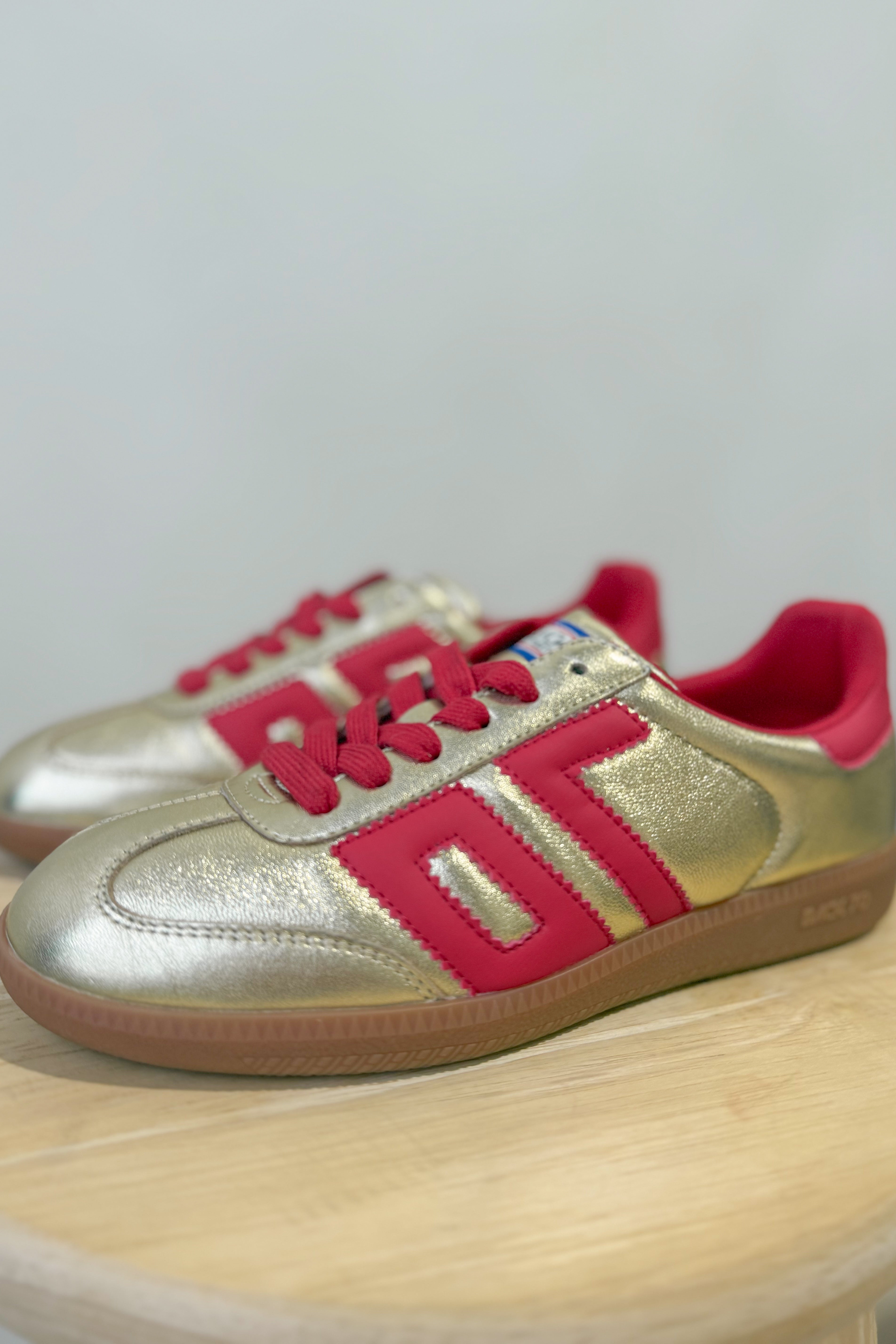 BACK70 Cloud Sneakers in gold and red with a sleek design, featuring 205 sneakers style and modern athletic details.