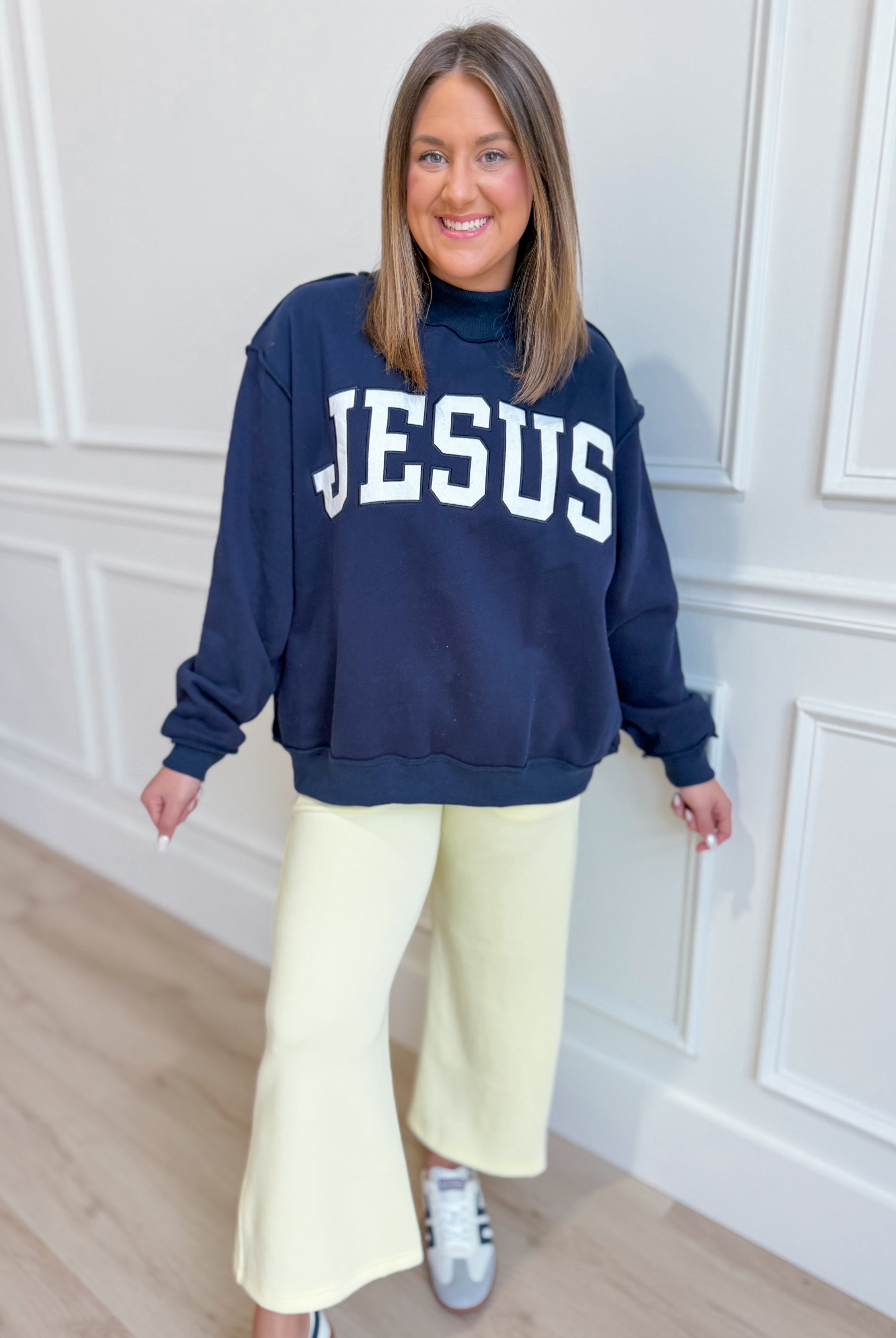 Jesus Navy mock embroidered sweatshirt from BUCKET LIST 137 Graphic Sweatshirts, featuring a navy fabric with embroidered Jesus design.