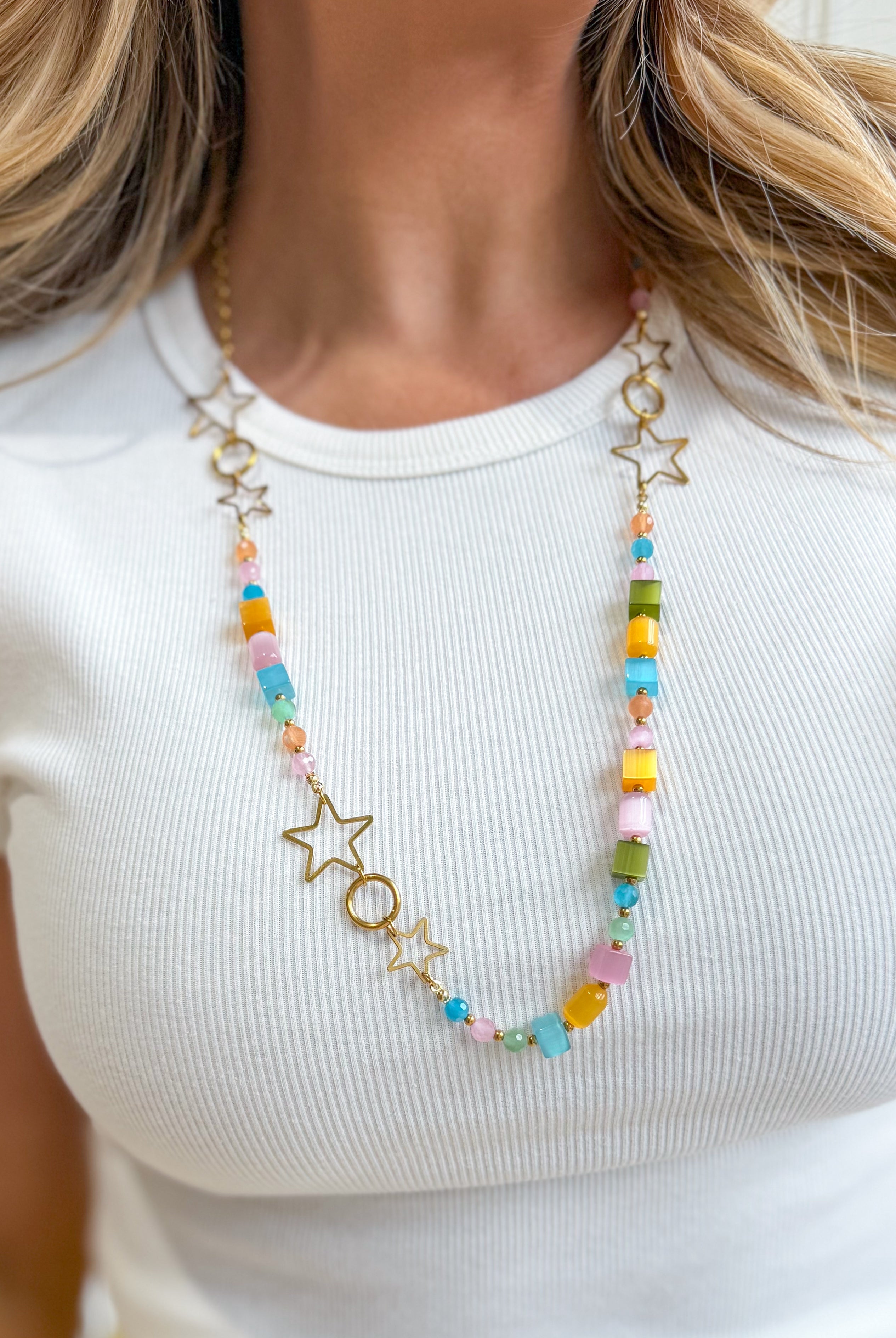 Treasure Jewels Head In The Stars Necklace featuring a celestial-inspired pendant with sparkling gemstones.