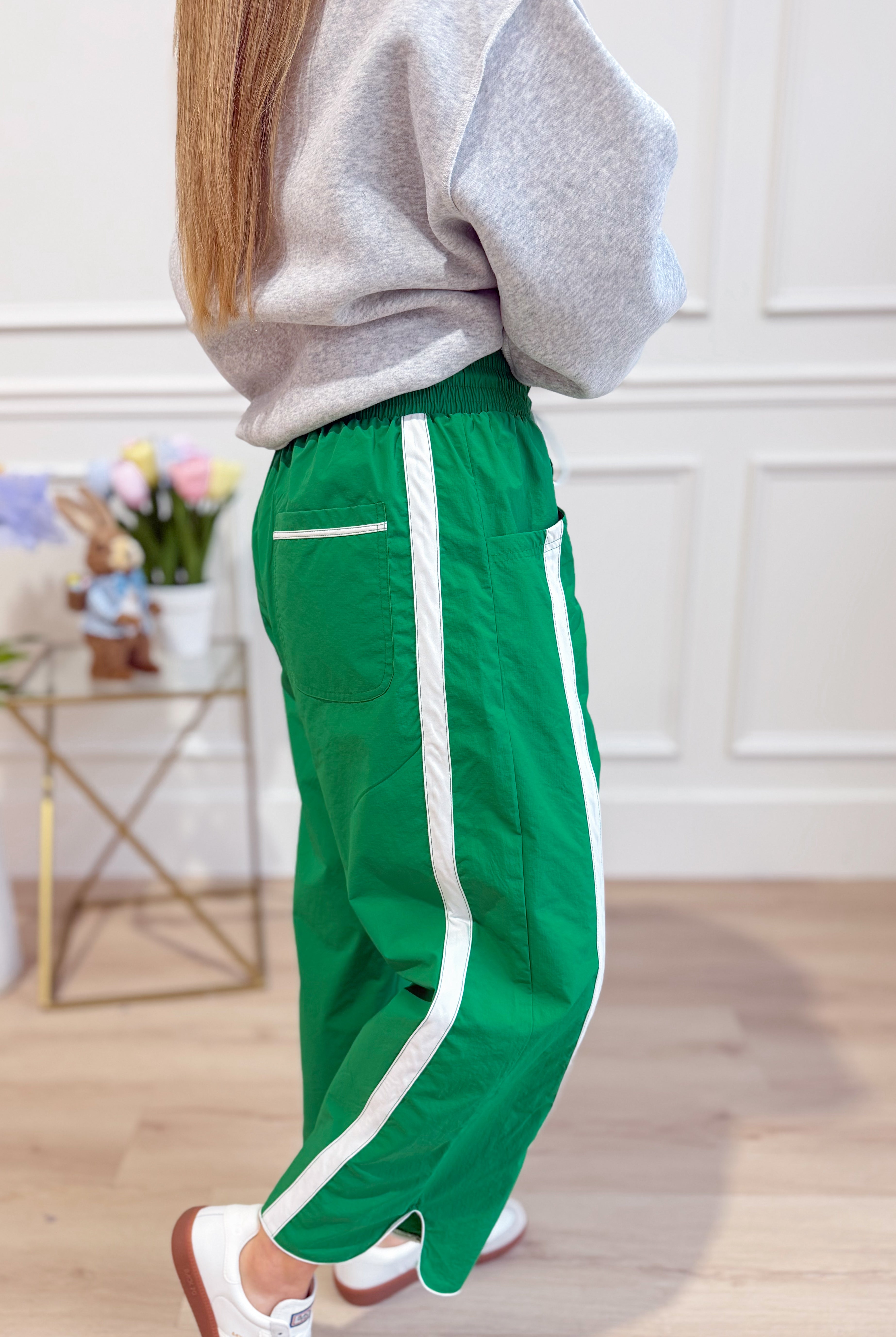 Lenny Windbreaker Contrasted Stripe Pants by BUCKET LIST, featuring a lightweight windbreaker fabric with bold stripe details.