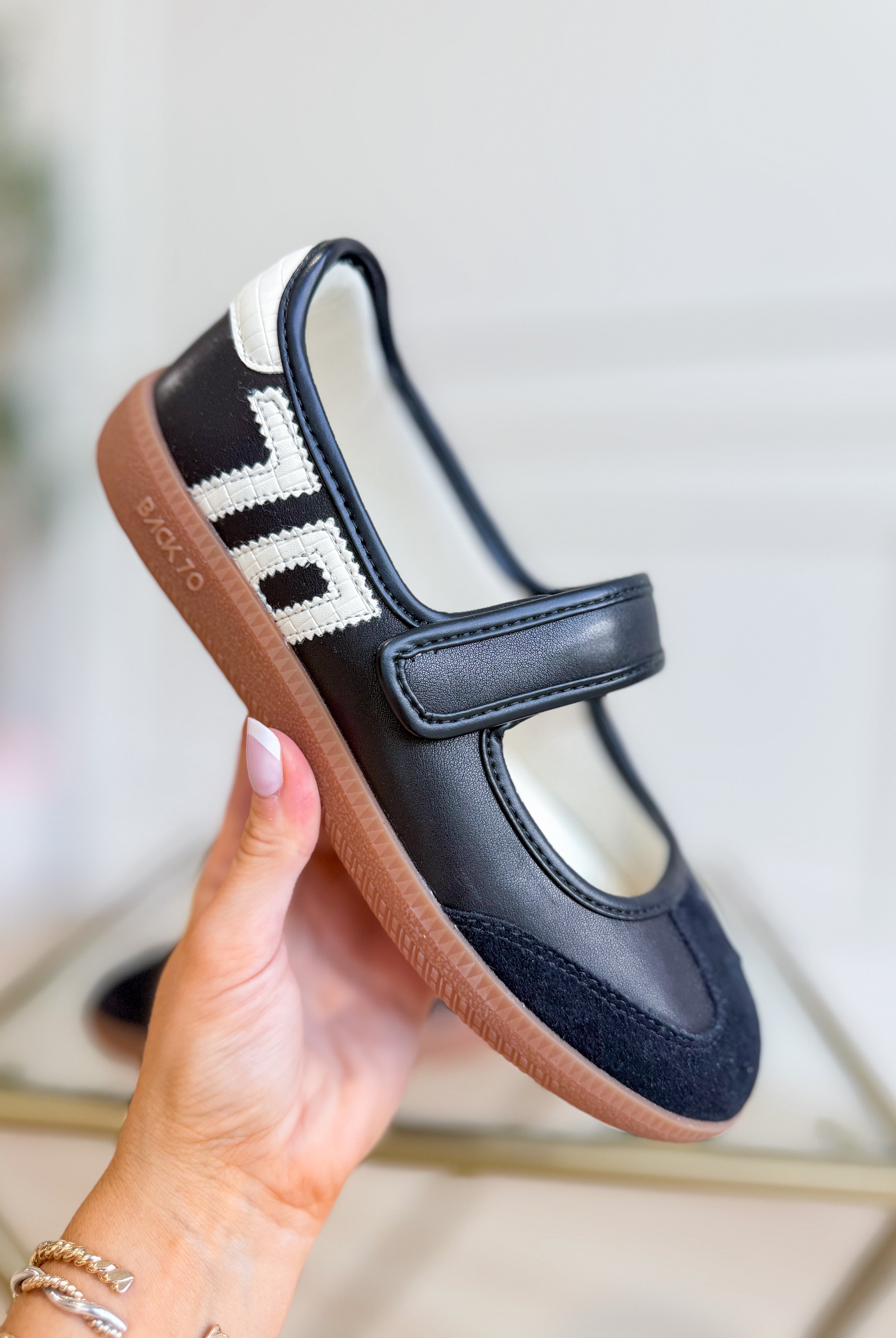 Black BACK 70 AYA Sneakers in 205 style featuring a sleek design and comfortable fit, shown on a clean background.