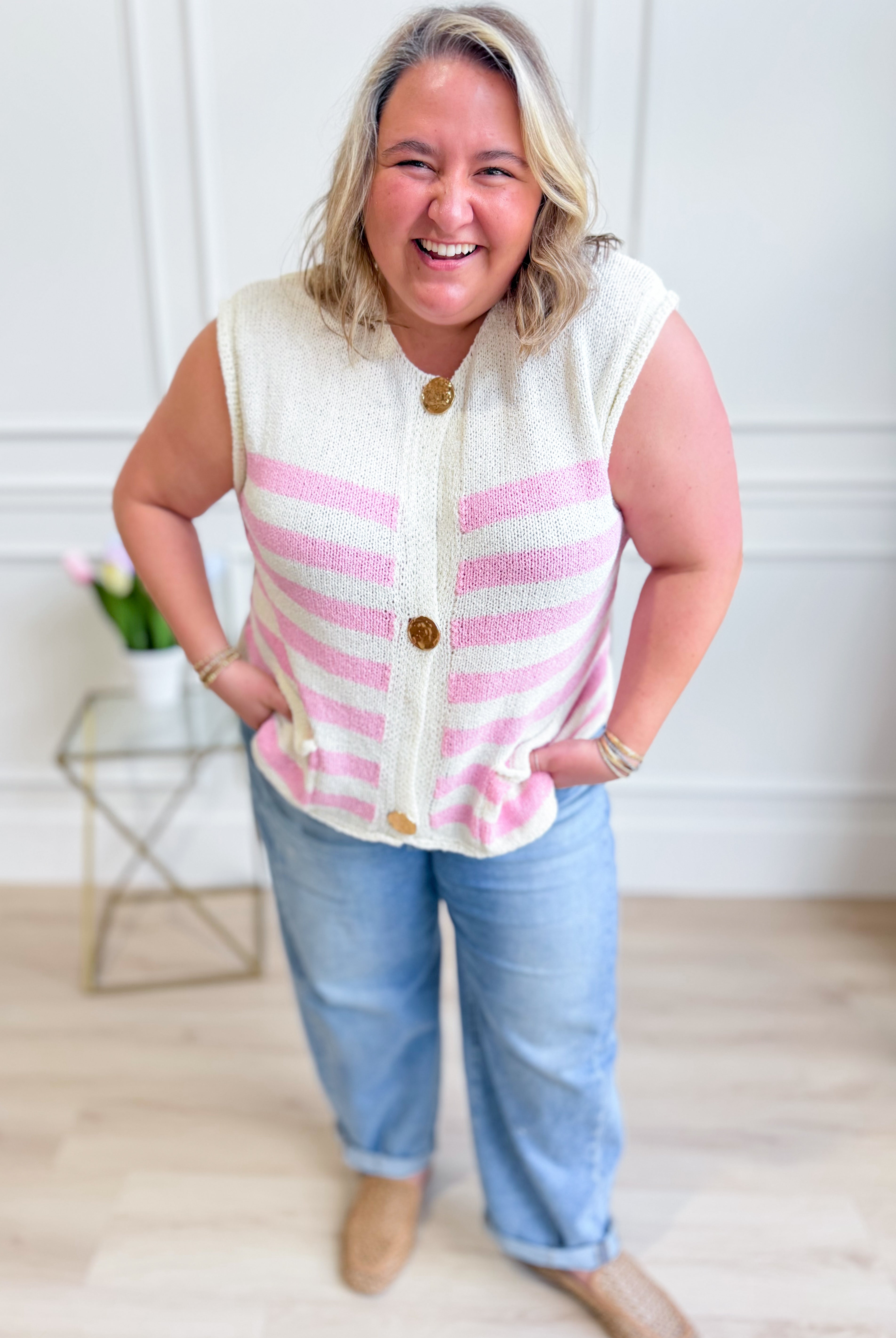Carrie striped sleeveless sweater top by SHE + SKY, stylish 131 Spring sweater, featuring colorful horizontal stripes and a fitted design.