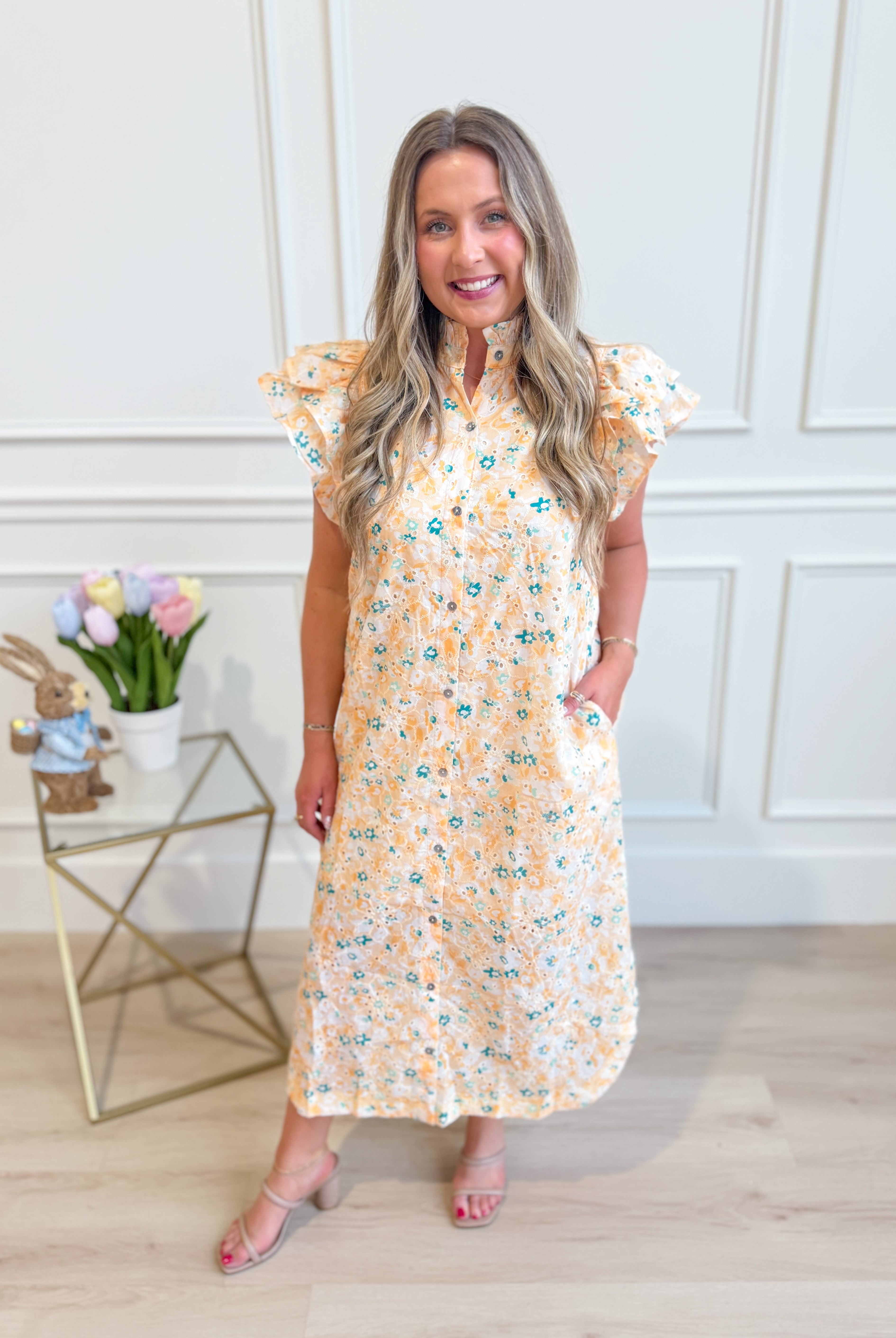 ENTRO Aubrey yellow floral flutter sleeve dress, lightweight and elegant, perfect for dressy occasions, shown on a model.