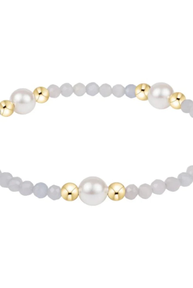 Enewton 6mm aquamarine pearl gold bracelet featuring aquamarine and gold beads on a delicate jewelry strand.