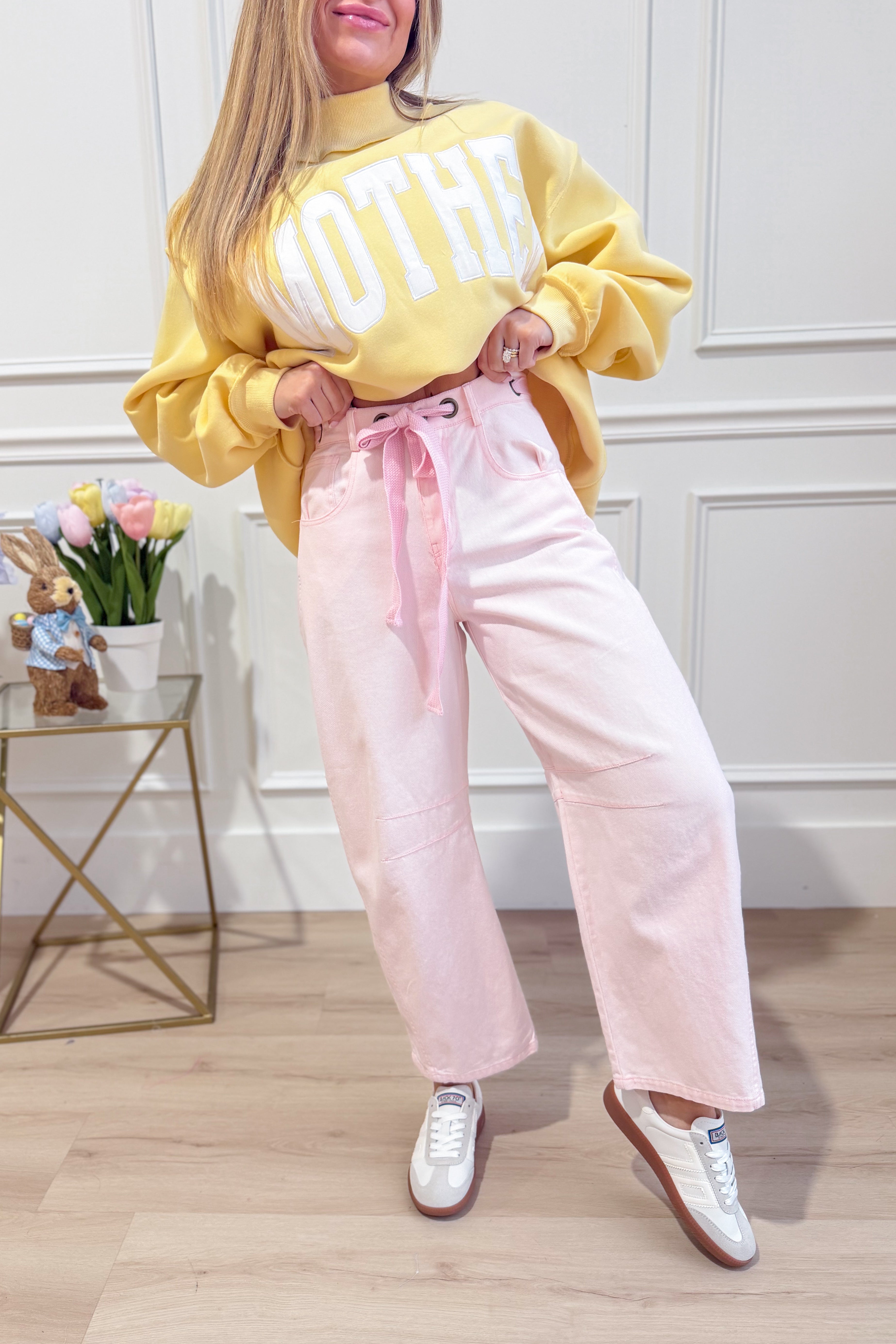 Light pink mineral washed barrel jeans from PEACH LOVE with eyelet details, part of the 147 Novelty Jeans collection.