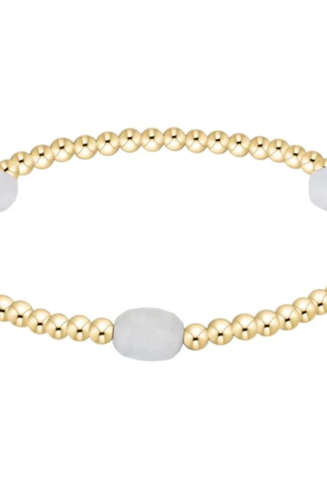 Enewton 3mm aquamarine admire gemstone, showcasing a sparkling blue aquamarine in a jewelry setting.