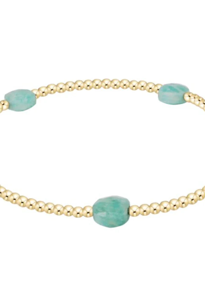 Enewton 2mm Amazonite admire small gem from 222 other jewelry collection, showcasing a vibrant blue-green gemstone.