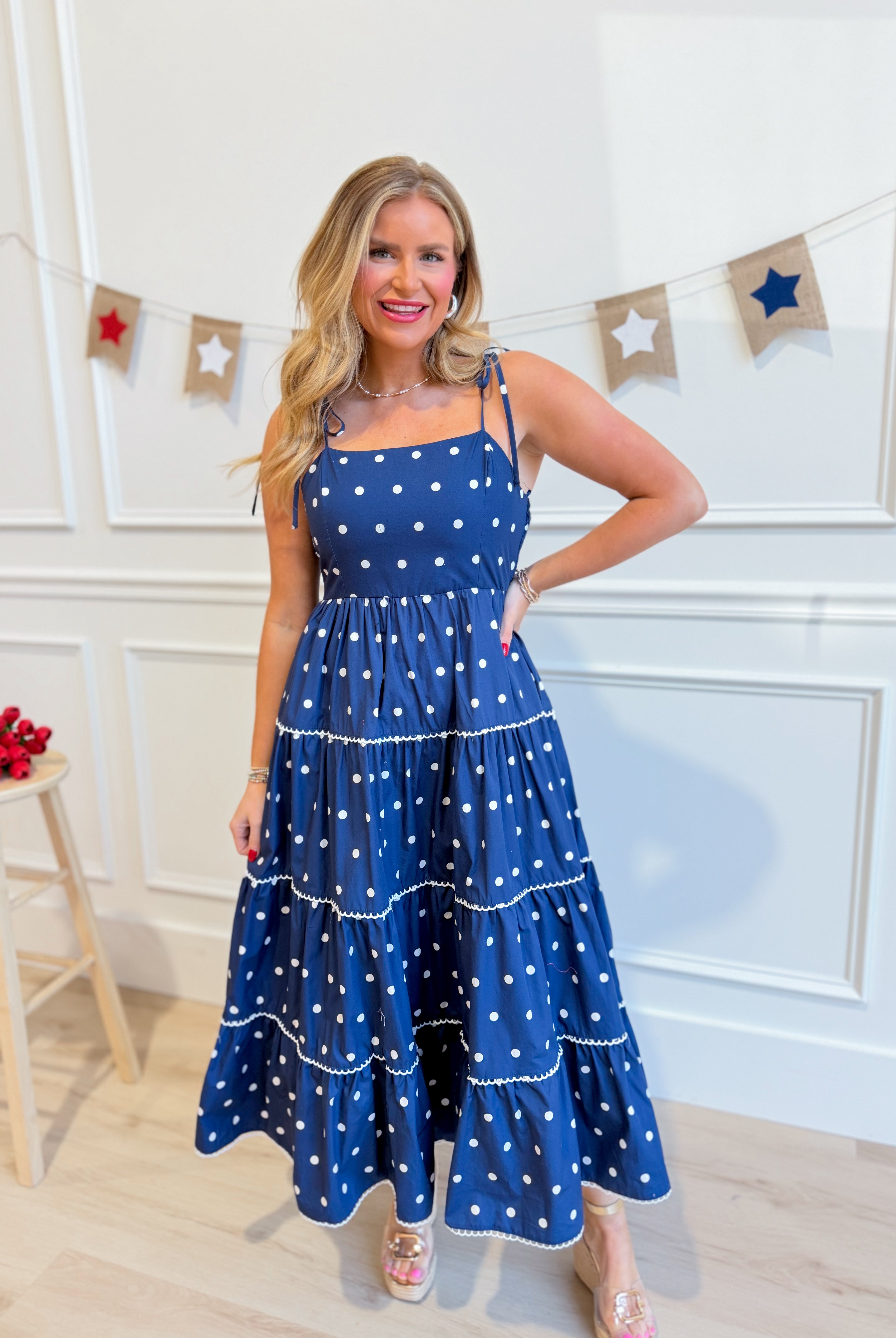 Vicki Polka Dot Tiered Midi Dress by PEACH LOVE, featuring a flowy, tiered design with black and white polka dots.