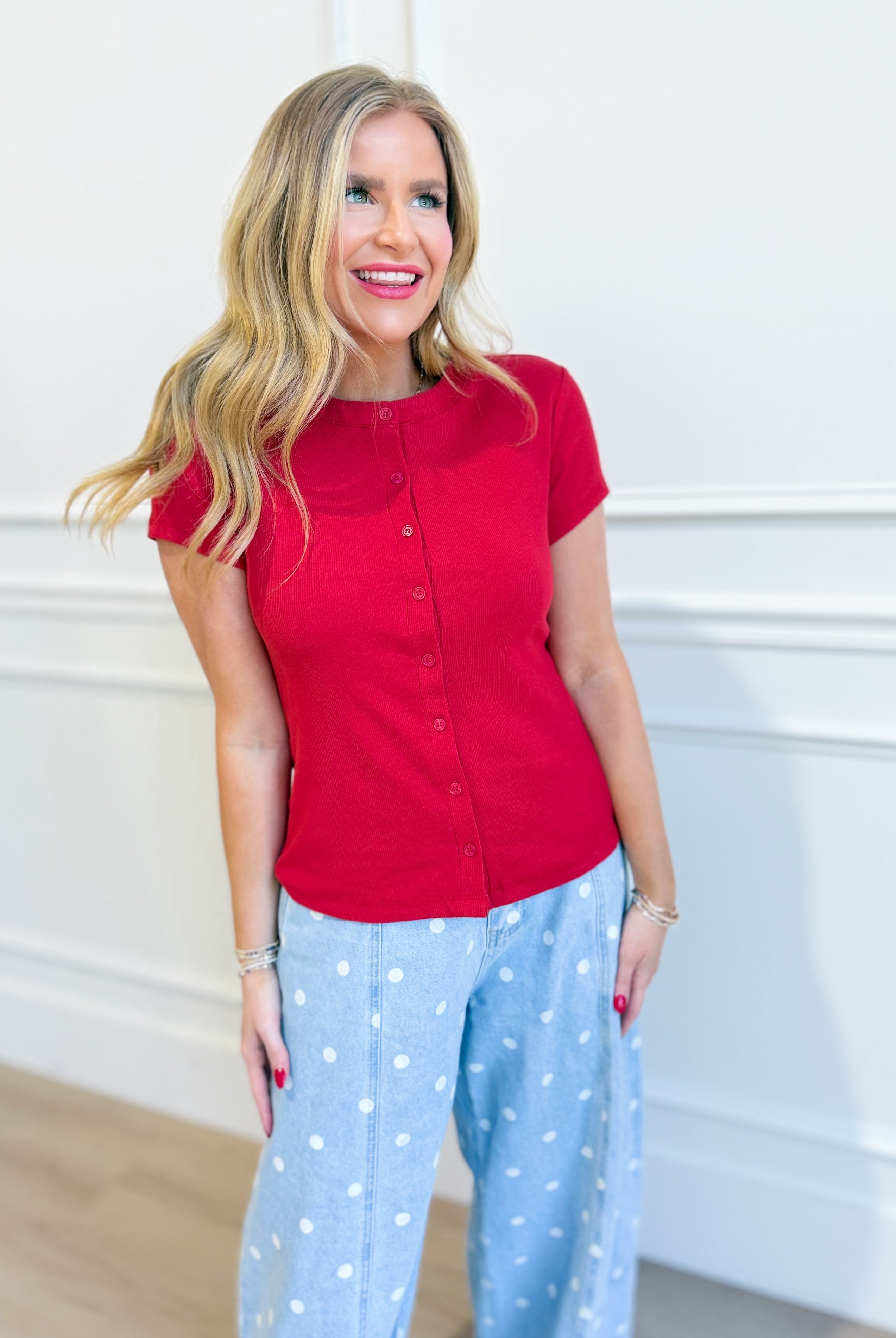 Ruth red ribbed button-up top by HYFVE, featuring a fitted design and classic collar, styled on a model.