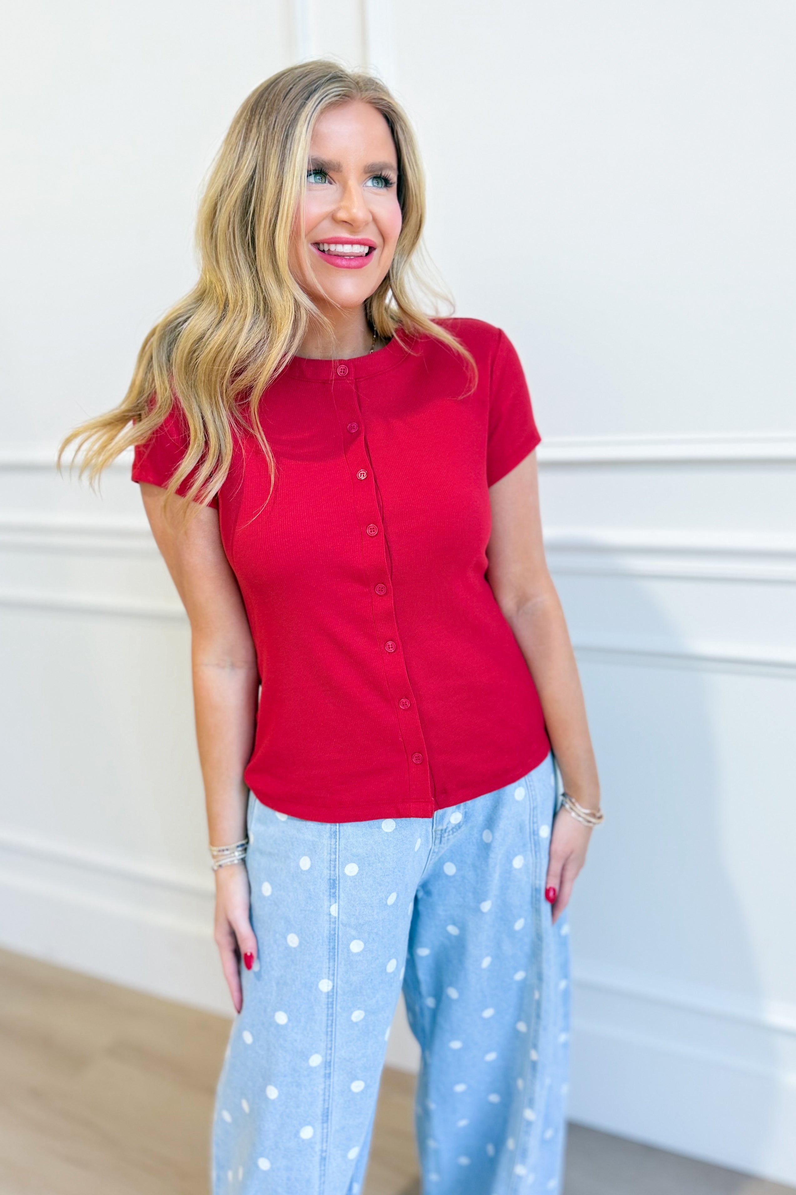 Ruth red ribbed button-up top by HYFVE, featuring a fitted design and classic collar, styled on a model.