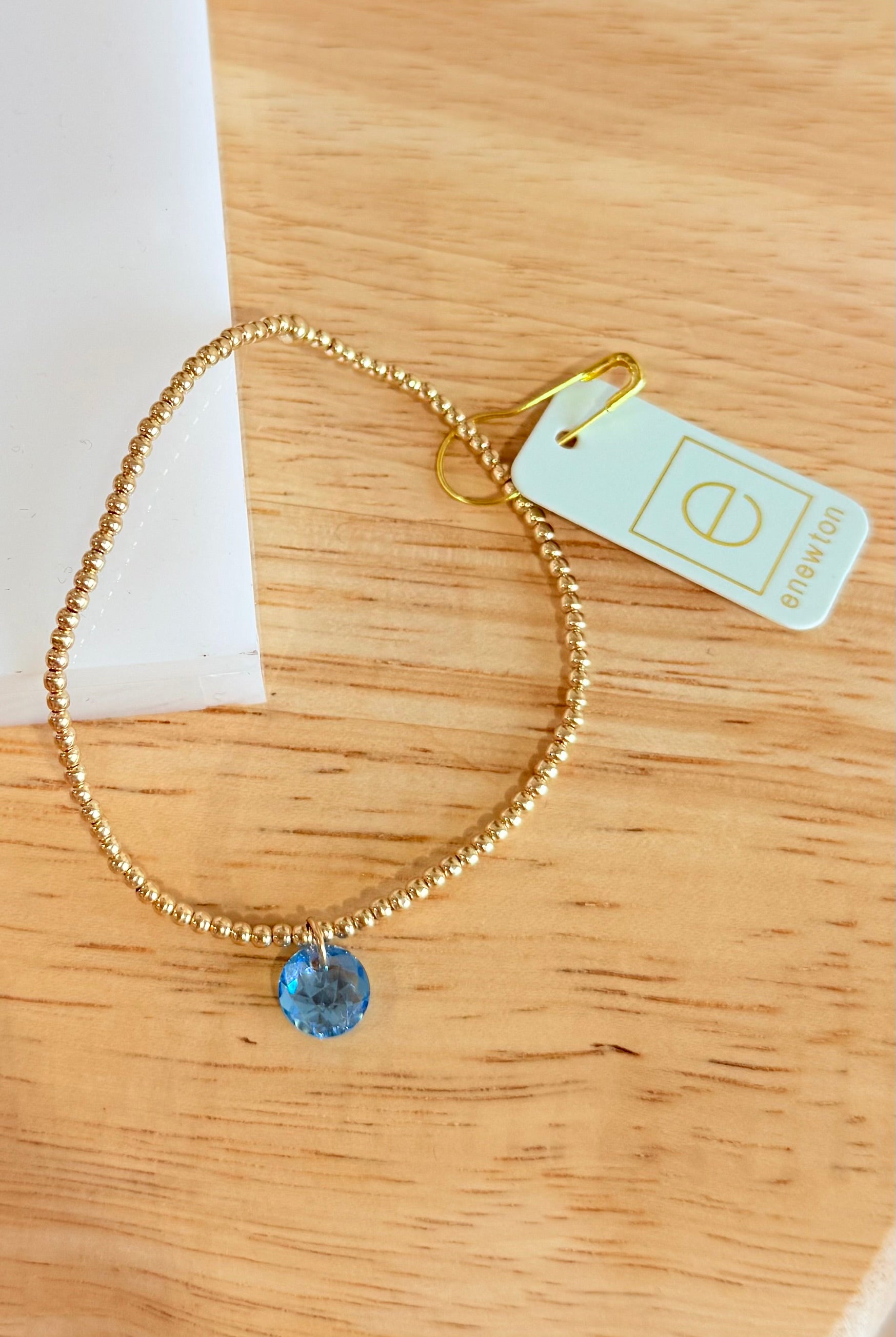Enewton 2mm classic birthstone bracelet with colorful stones on a silver chain, showcasing elegant jewelry design.