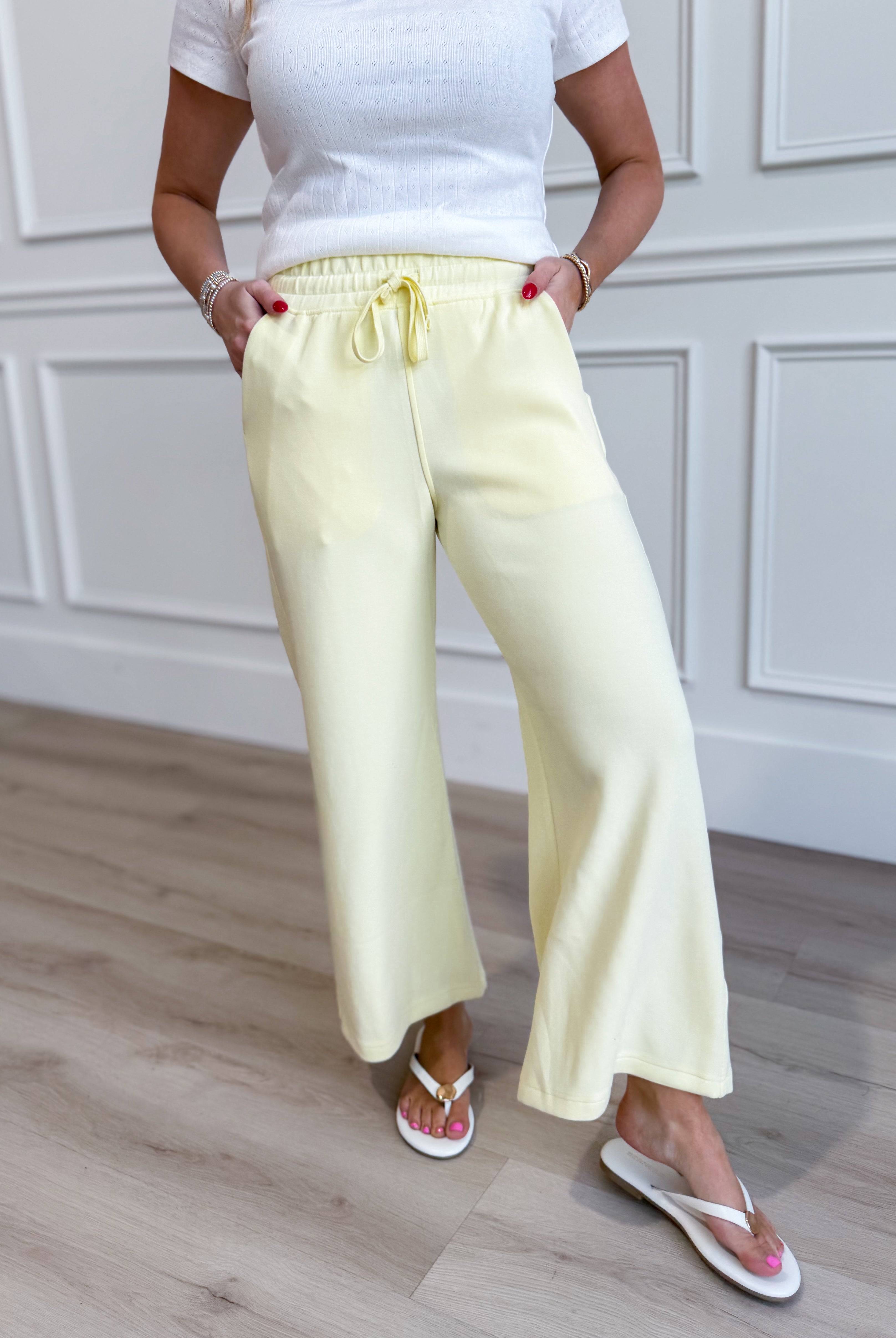 Raé Mode Norma Lemon Cropped Wide Leg Pants displayed on a model, showcasing their relaxed fit and stylish wide leg design.