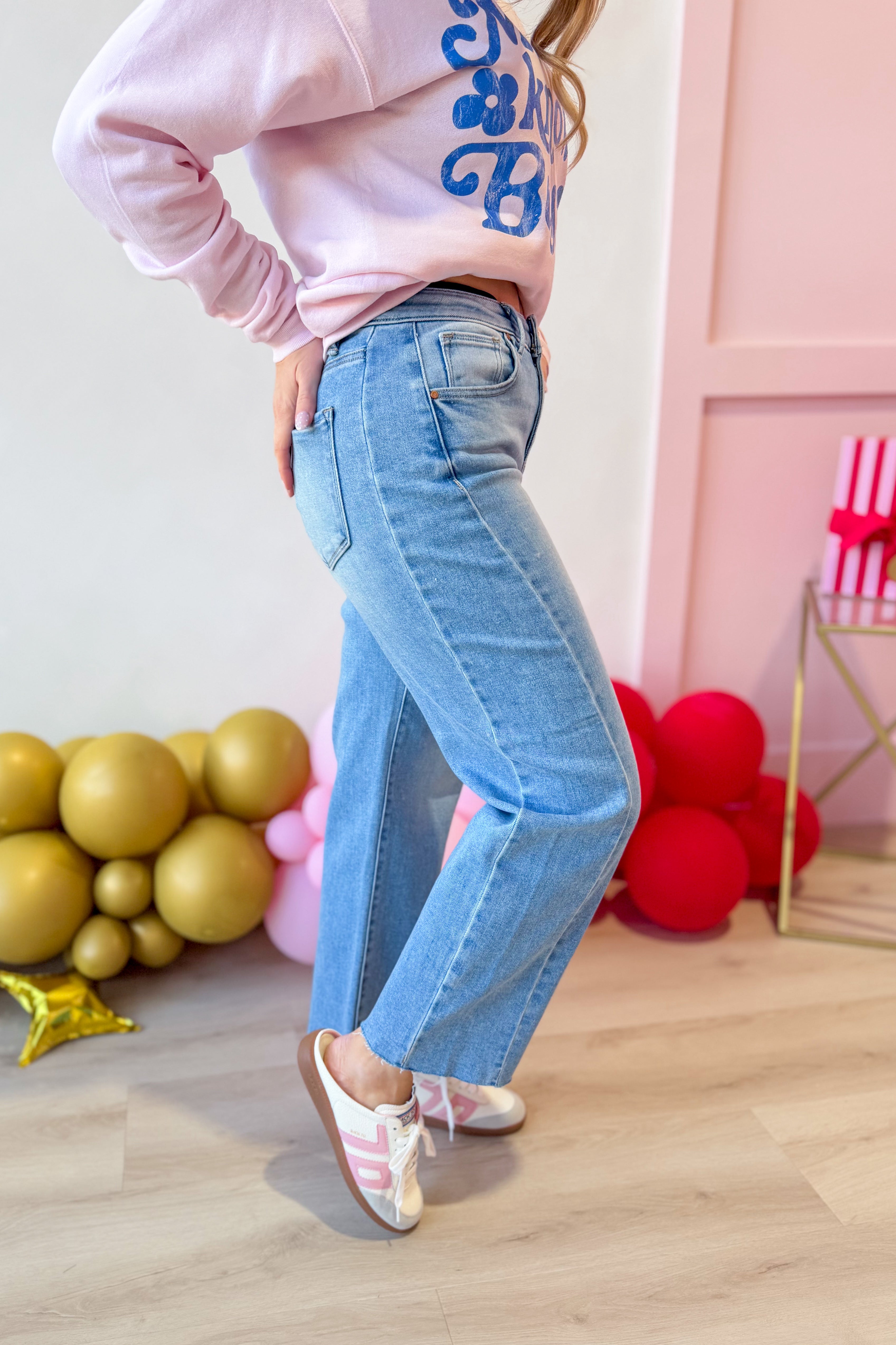 Risen Boone high-rise slouchy cropped barrel jeans in light denim, showcasing relaxed fit and distressed details.