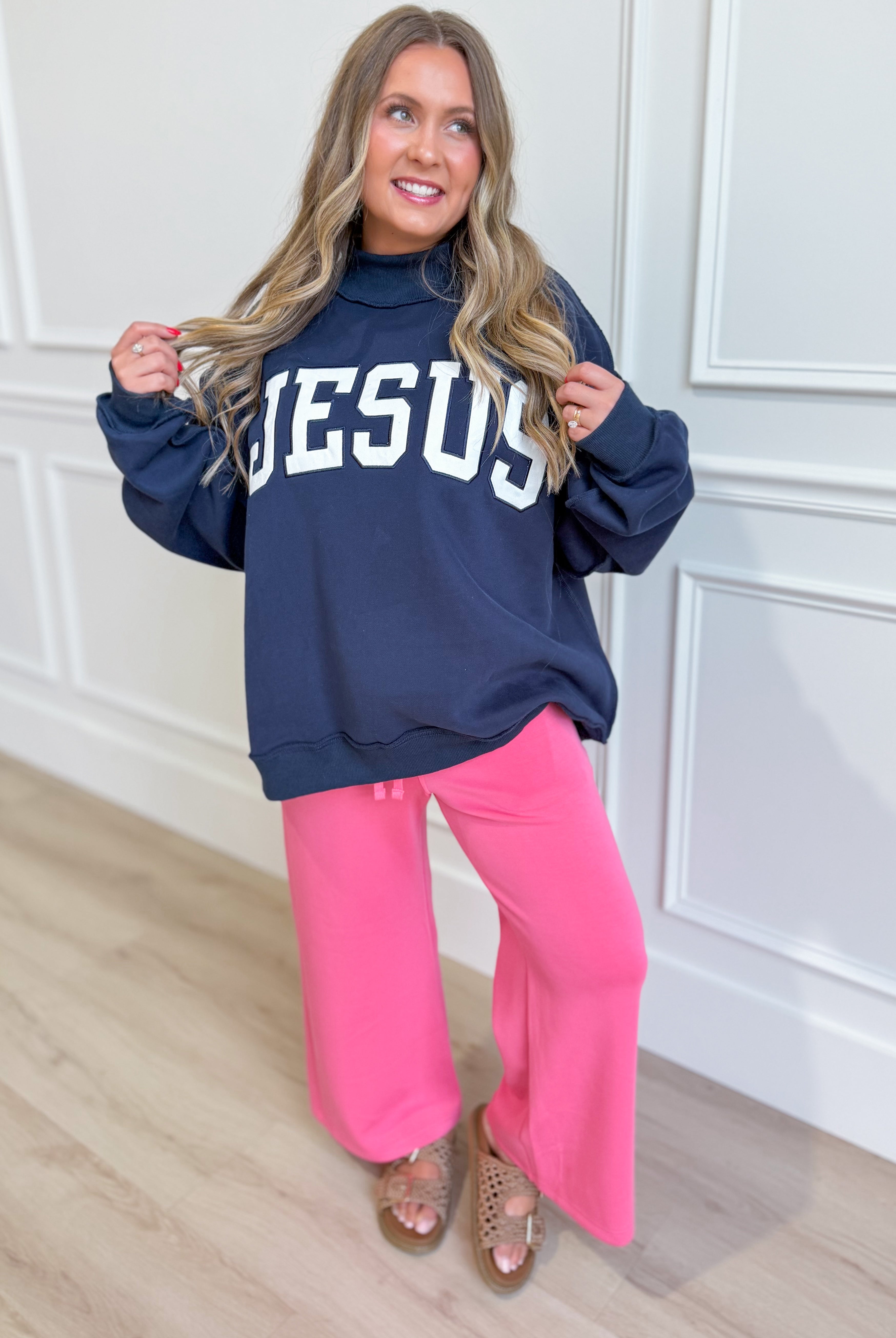 Jesus Navy mock embroidered sweatshirt from BUCKET LIST featuring graphic design on the front and a comfortable crewneck fit.