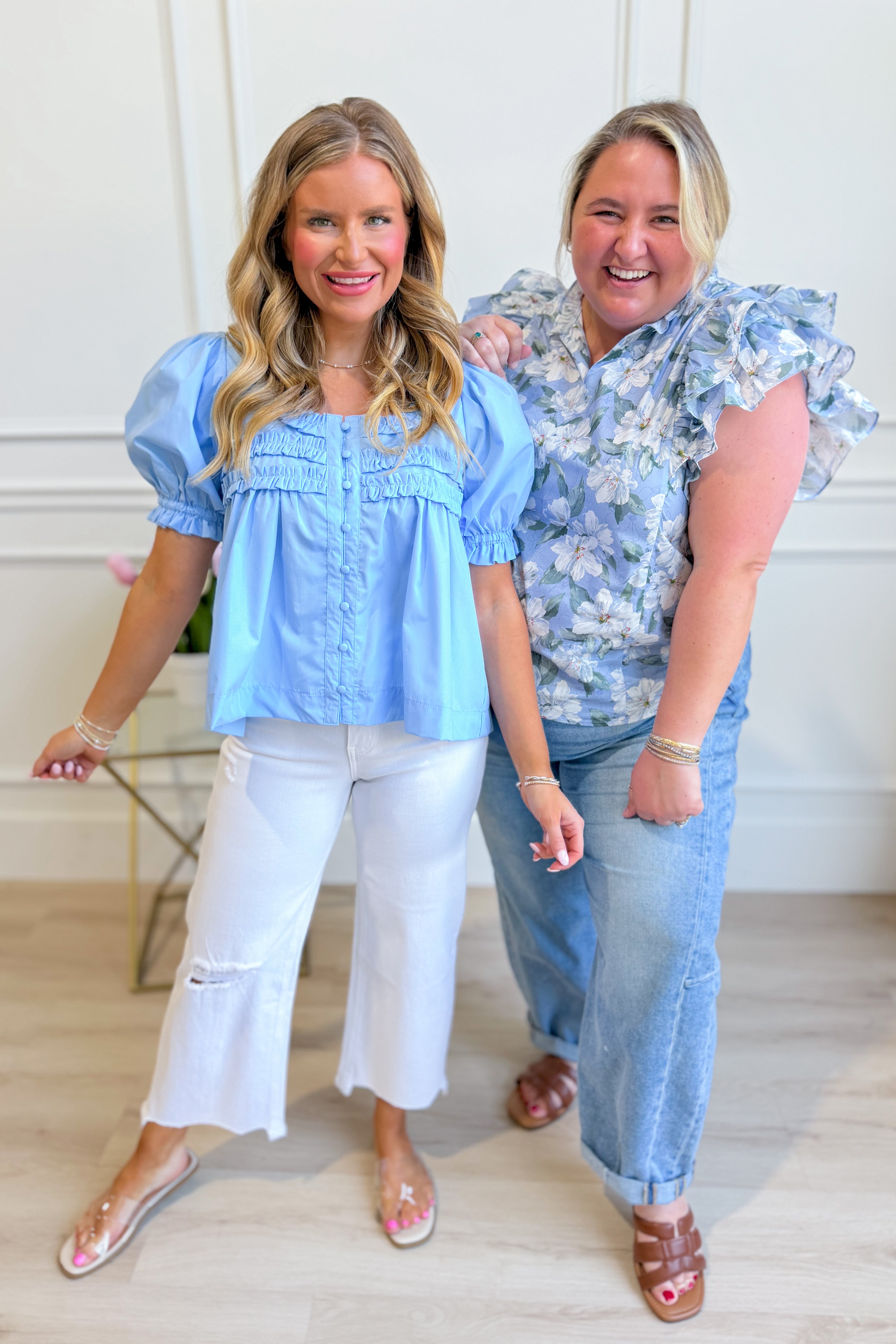 Light blue puff sleeve frilly top from ENTRO, stylish and dressy, with ruffled details and a feminine fit.