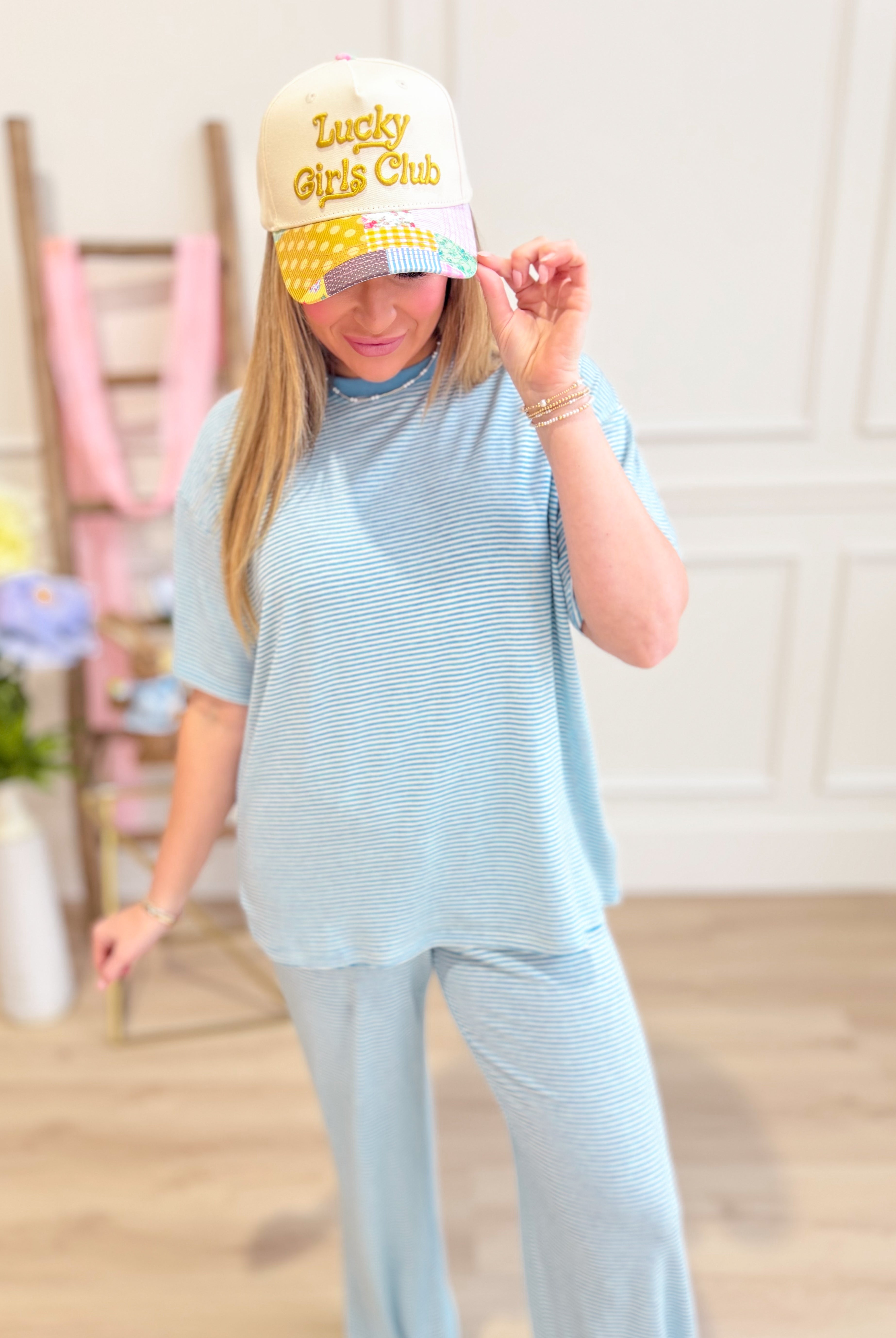 Logan Mini Striped Short Sleeve Top by THINGS BETWEEN, casual 105 top with navy and white stripes, shown on a model.