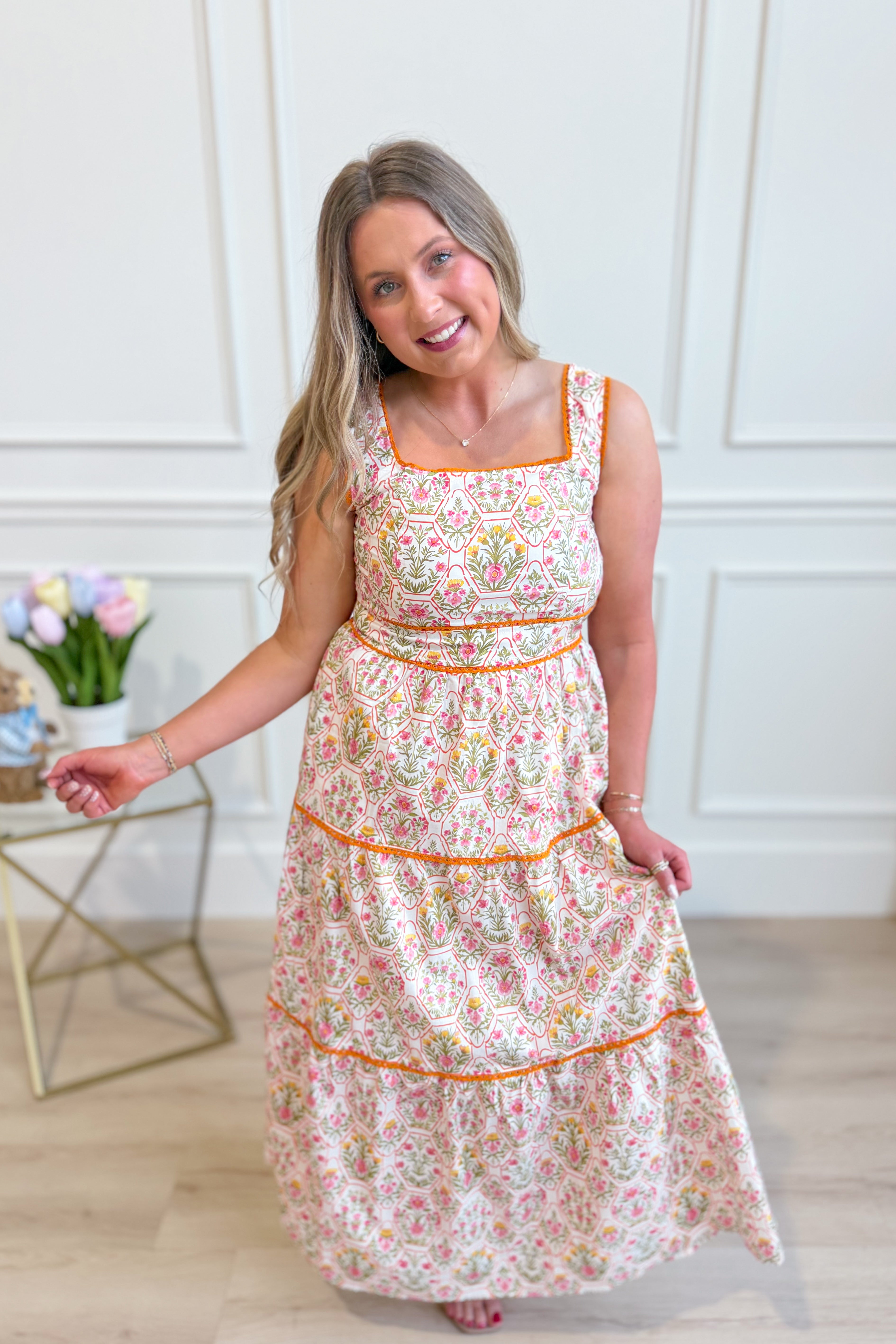 IN LOOM Miracle Cotton floral square neck maxi dress displayed on a hanger with a vibrant floral pattern and flowing silhouette.