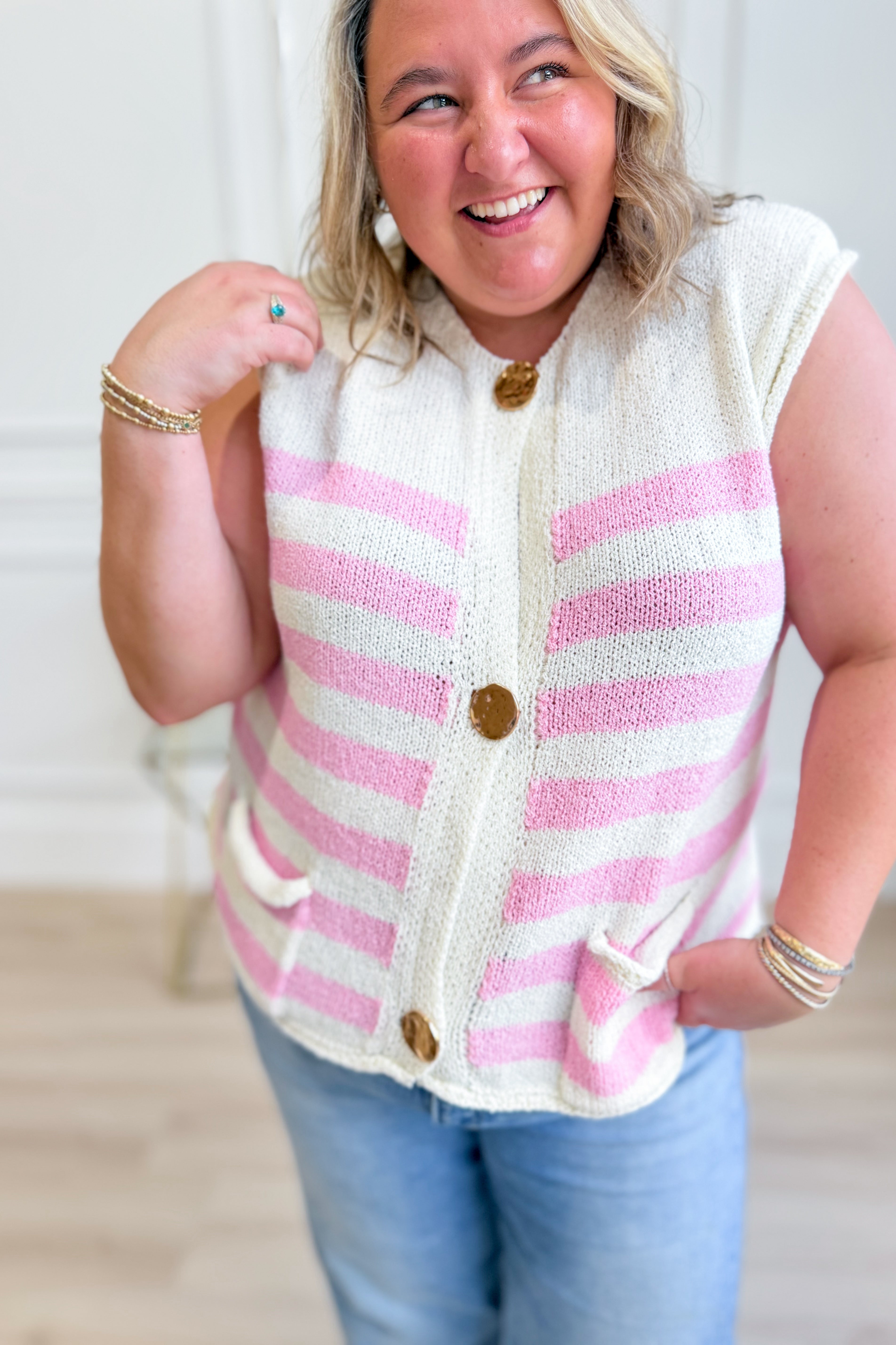 She + Sky Carrie striped sleeveless sweater top with a fitted design and bold horizontal stripes, perfect for spring.