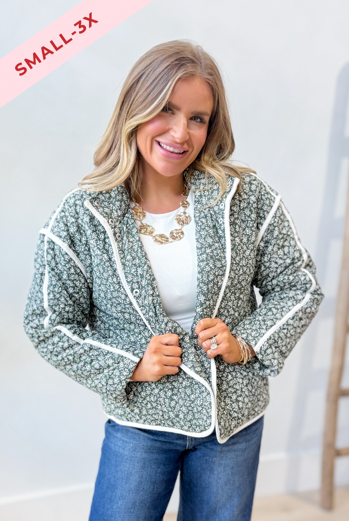 Baevly Xavier floral printed 140 outerwear jacket with colorful floral design and lightweight fabric, hanging on a hanger.