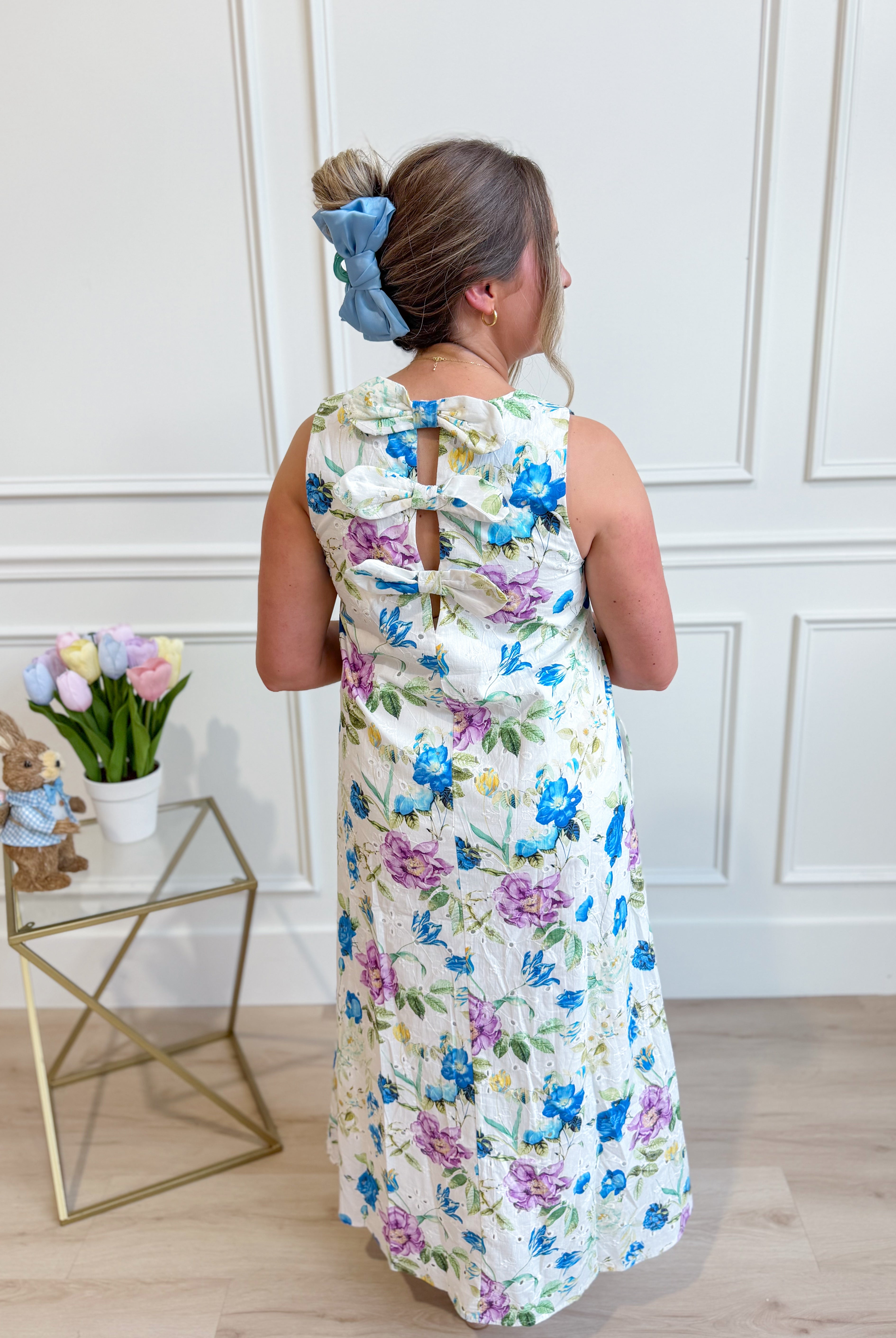 Blue floral midi dress by ENTRO featuring a botanical print, elegant flowy fabric, and a stylish dressy design.
