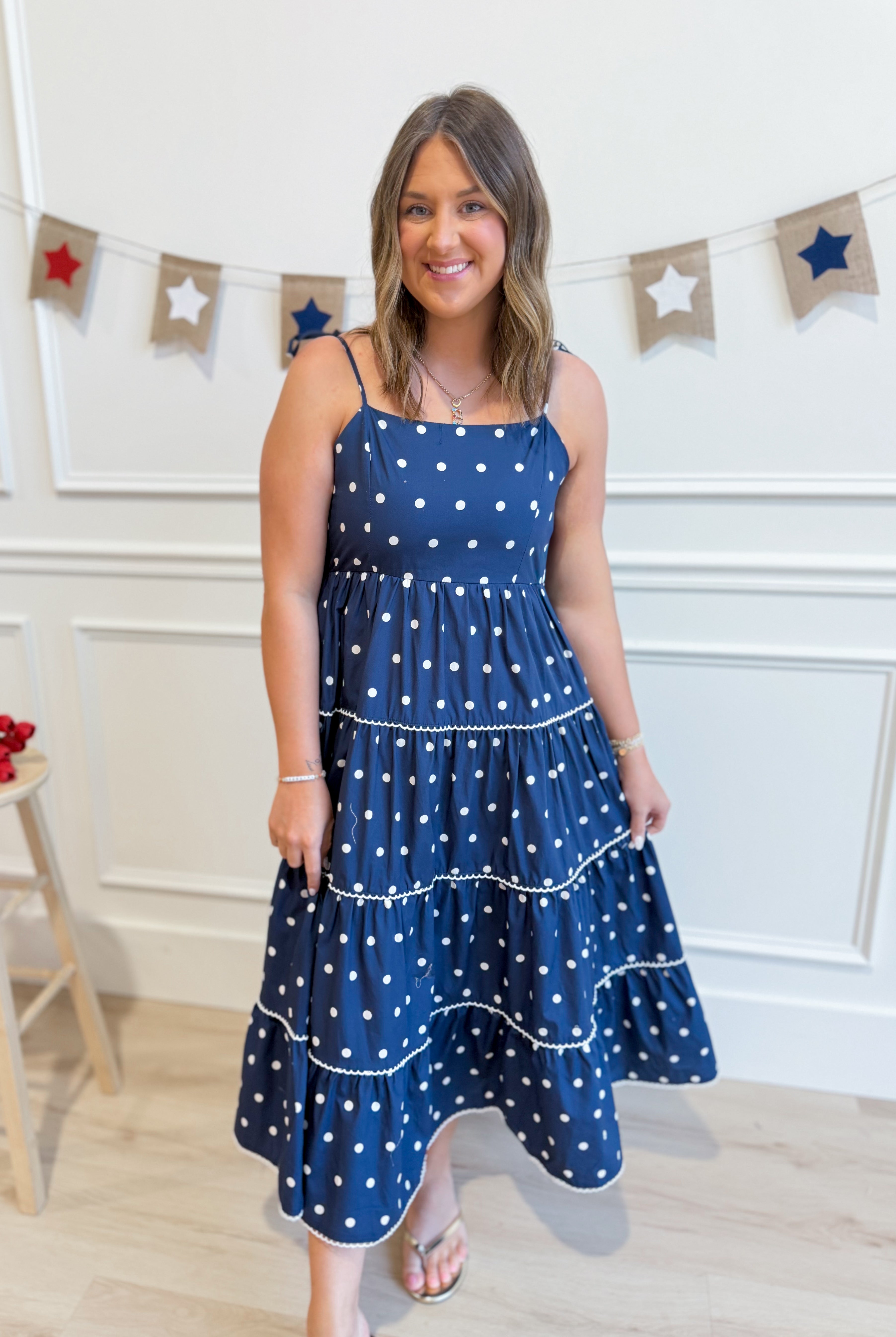 Vicki Polka Dot Tiered Midi Dress by PEACH LOVE, featuring a casual, layered design with polka dot pattern and sleeveless style.