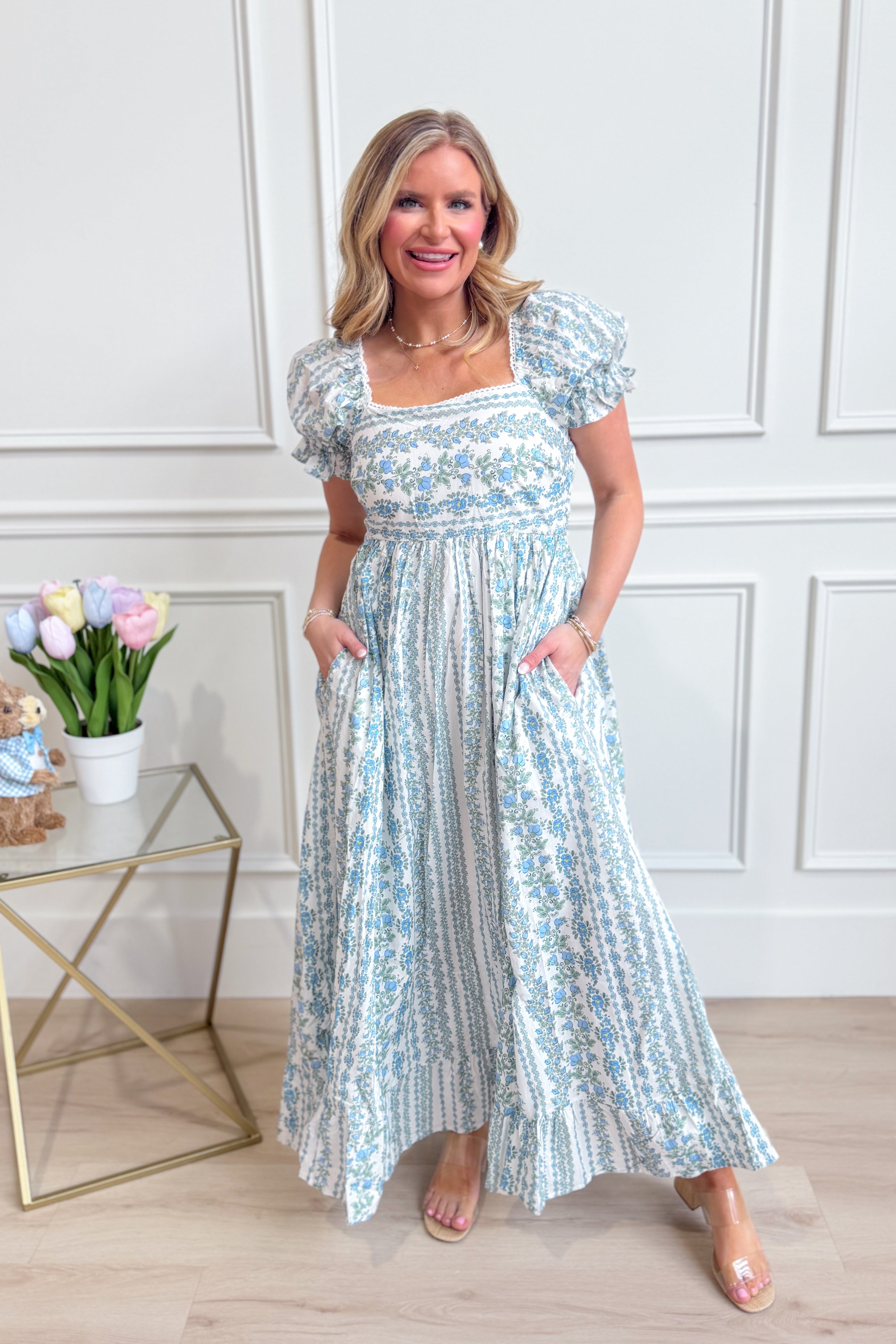 IN LOOM French floral cotton maxi dress with a flowing silhouette and vibrant floral pattern, perfect for elegant summer wear.