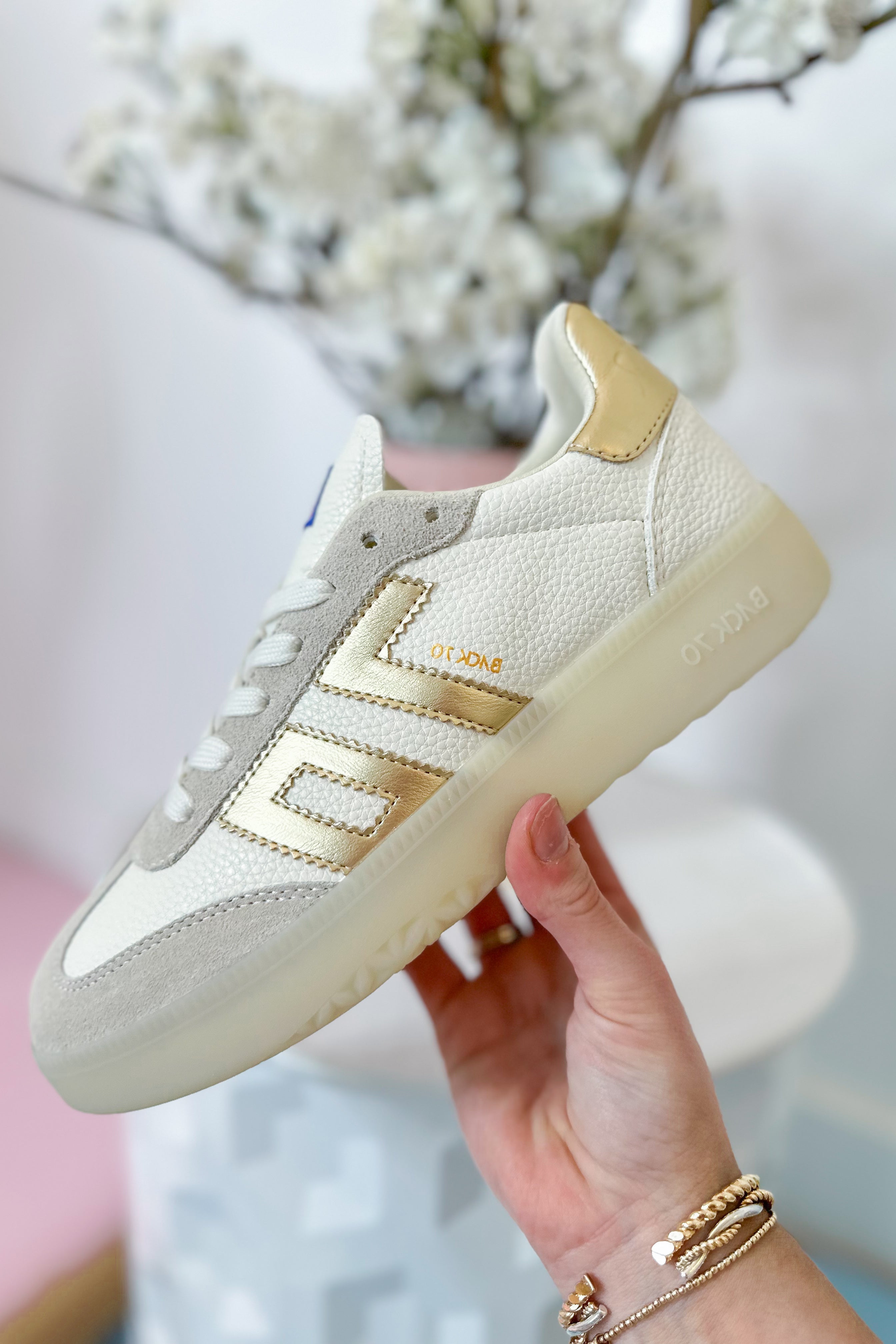 BACK 70 Boston 2502 Gold sneaker with 205 design, featuring a sleek gold finish and modern athletic style.