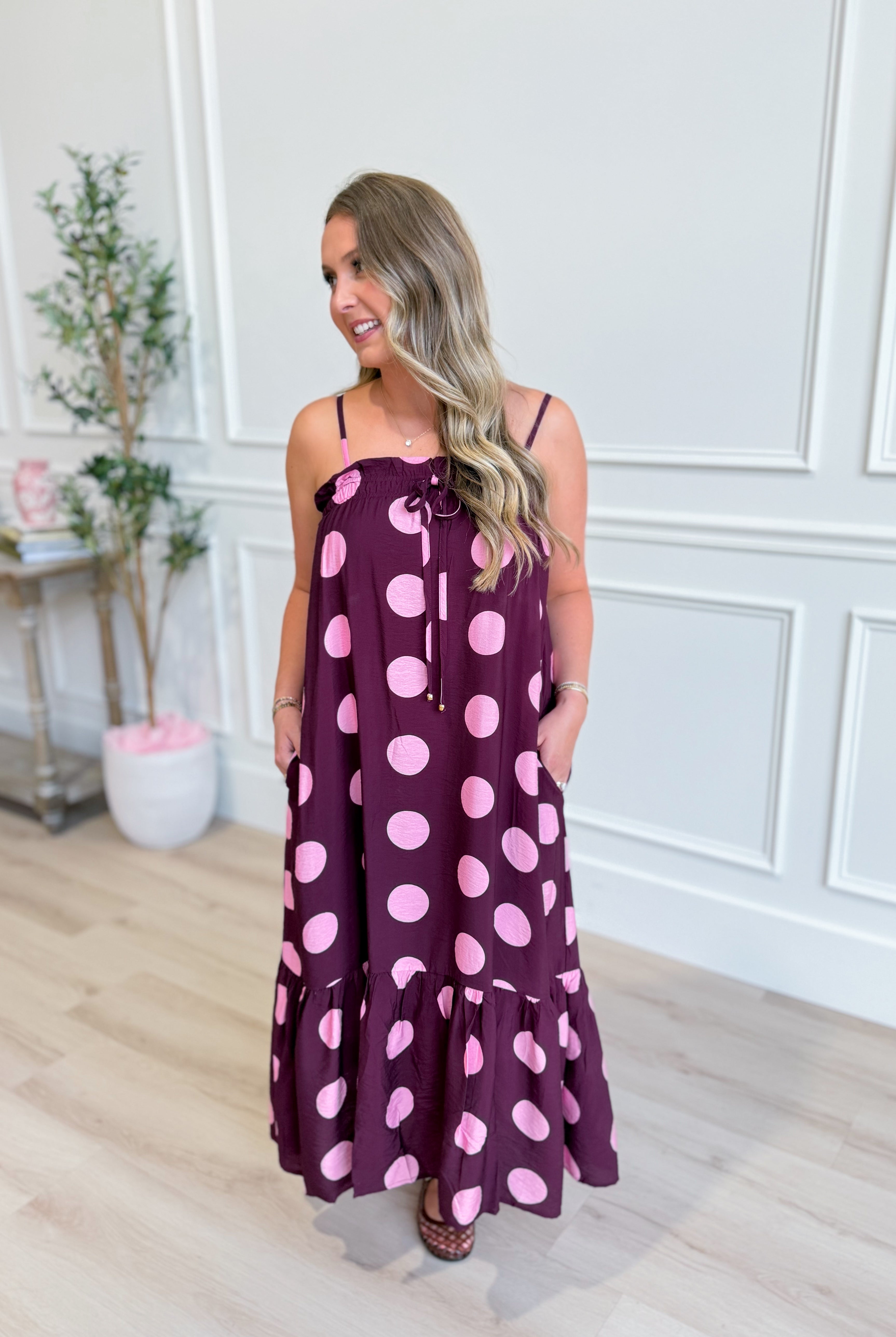 ENTRO Ashton polka dot midi dress, 125 dressy dress with a fitted waist and flared skirt, showcased on a model.