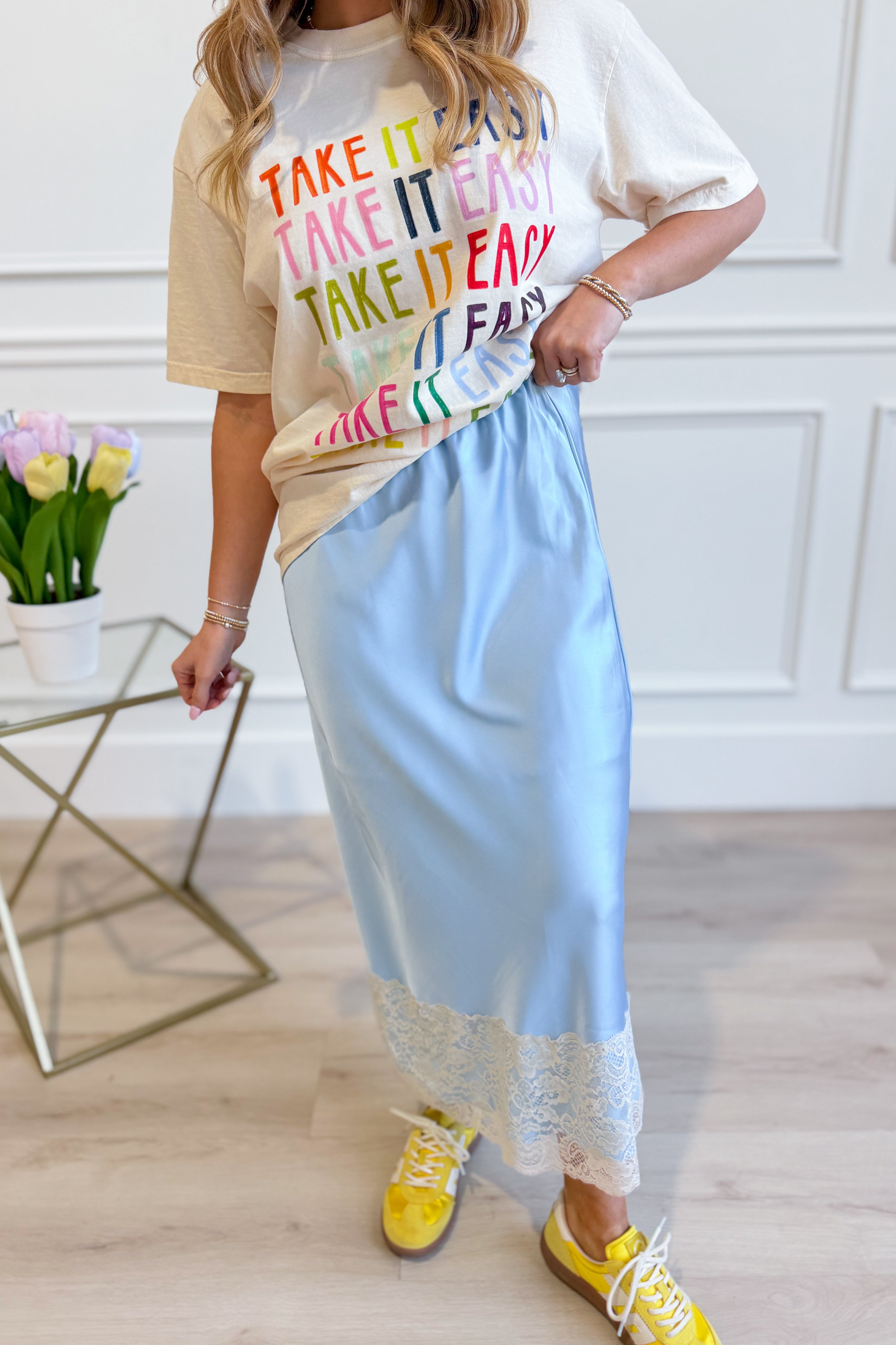 WISHLIST Conrad Silky Satin Lace Trim Skirt in a smooth satin fabric with delicate lace detailing, styled for a chic look.