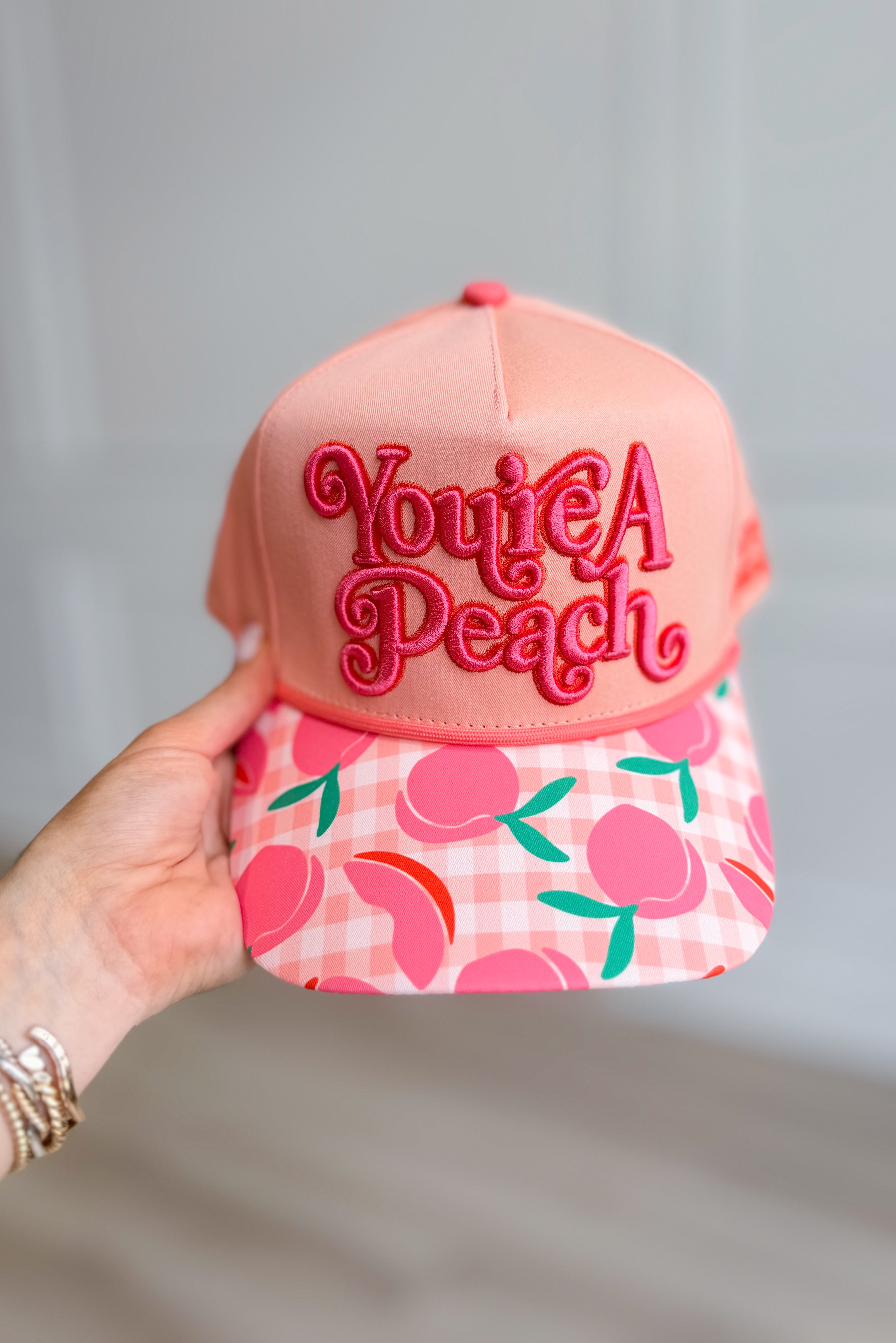Pink peach-shaped hair accessory hat from POPPY & PINE's 217 Hair Accessories collection, featuring playful, decorative design.