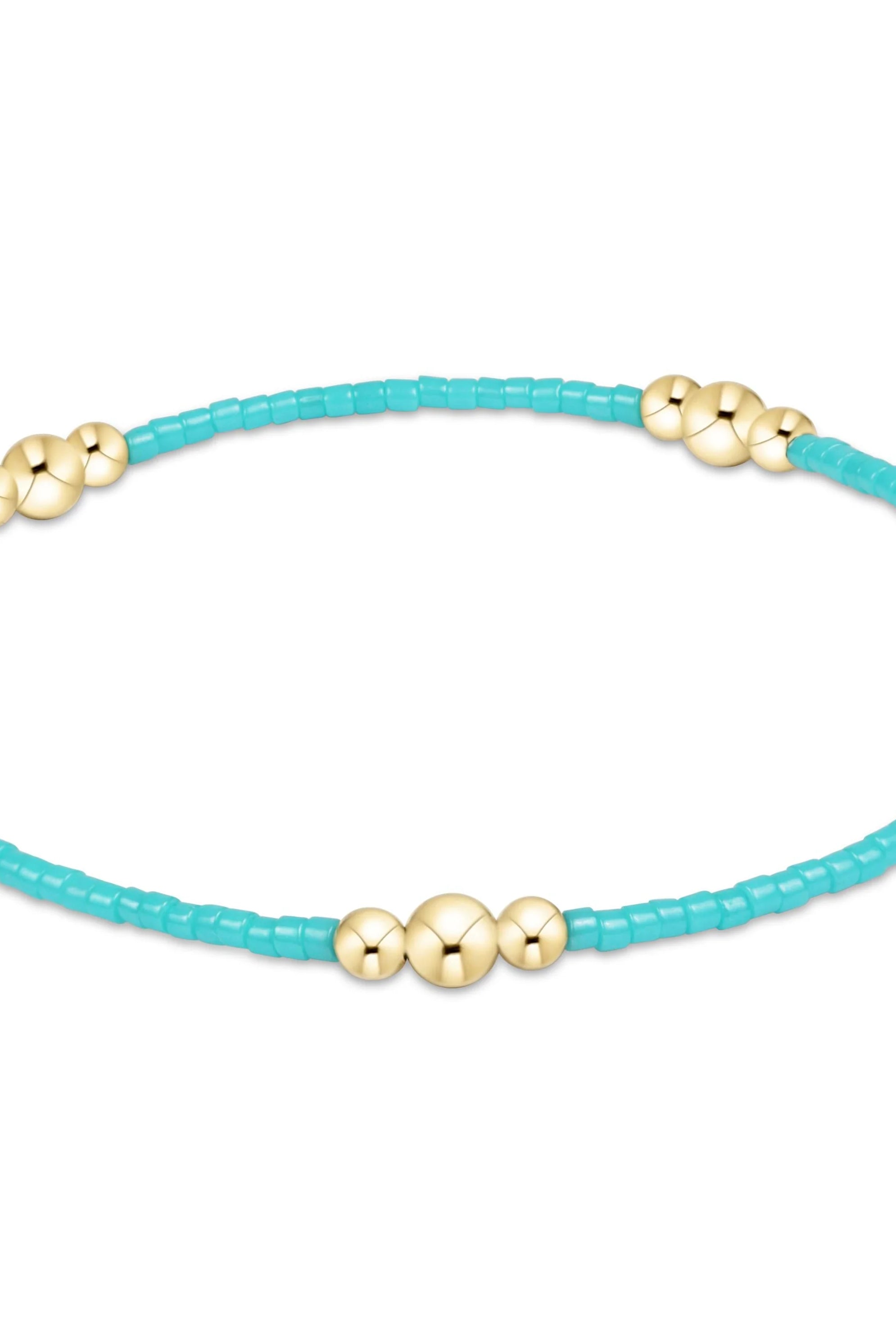 Enewton turquoise hope purpose gold bracelet with a sleek design, featuring a turquoise stone and gold accents.