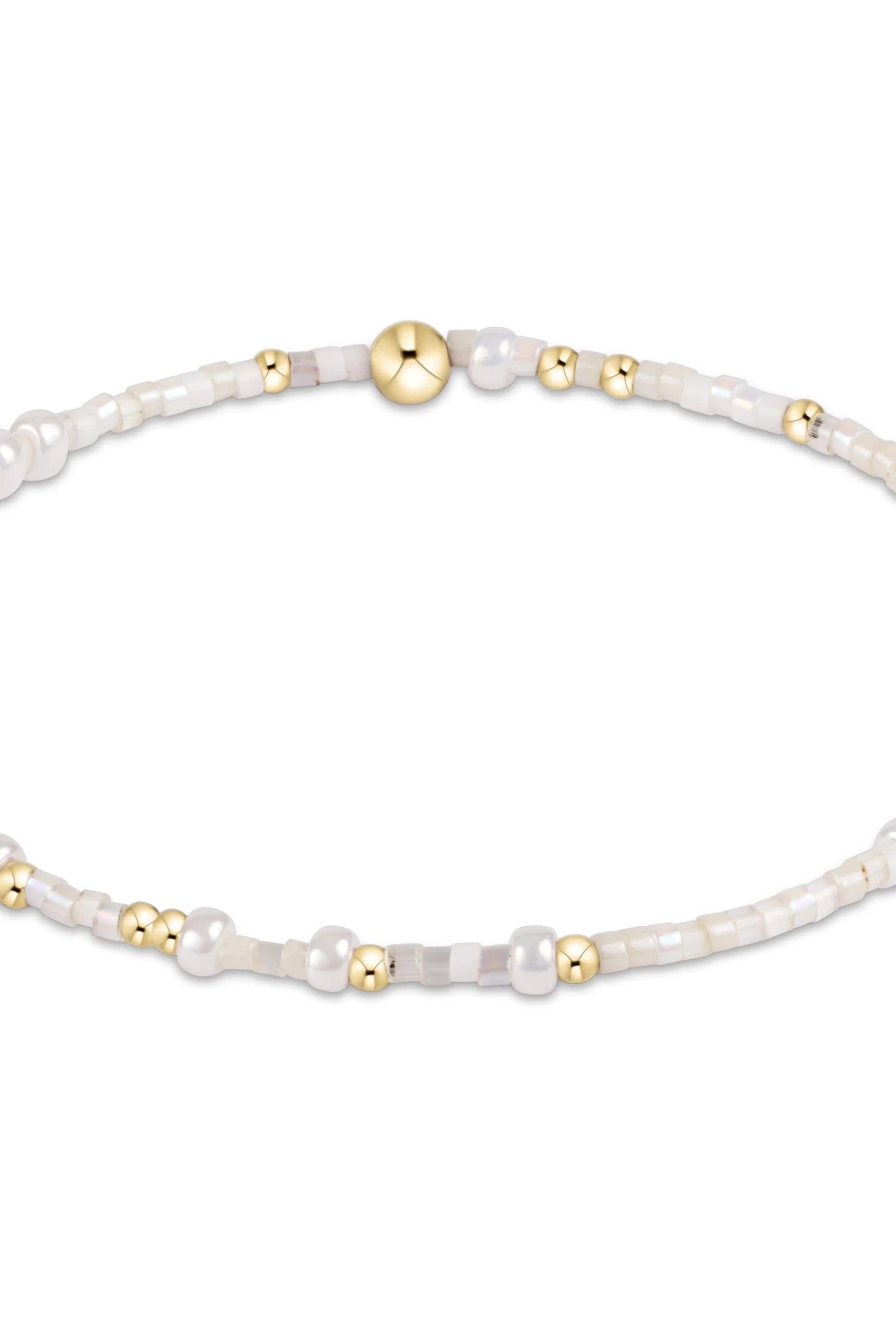 Enewton Spring Summer Hope Unwritten bracelet with silver chain and charm, styled on a white background.
